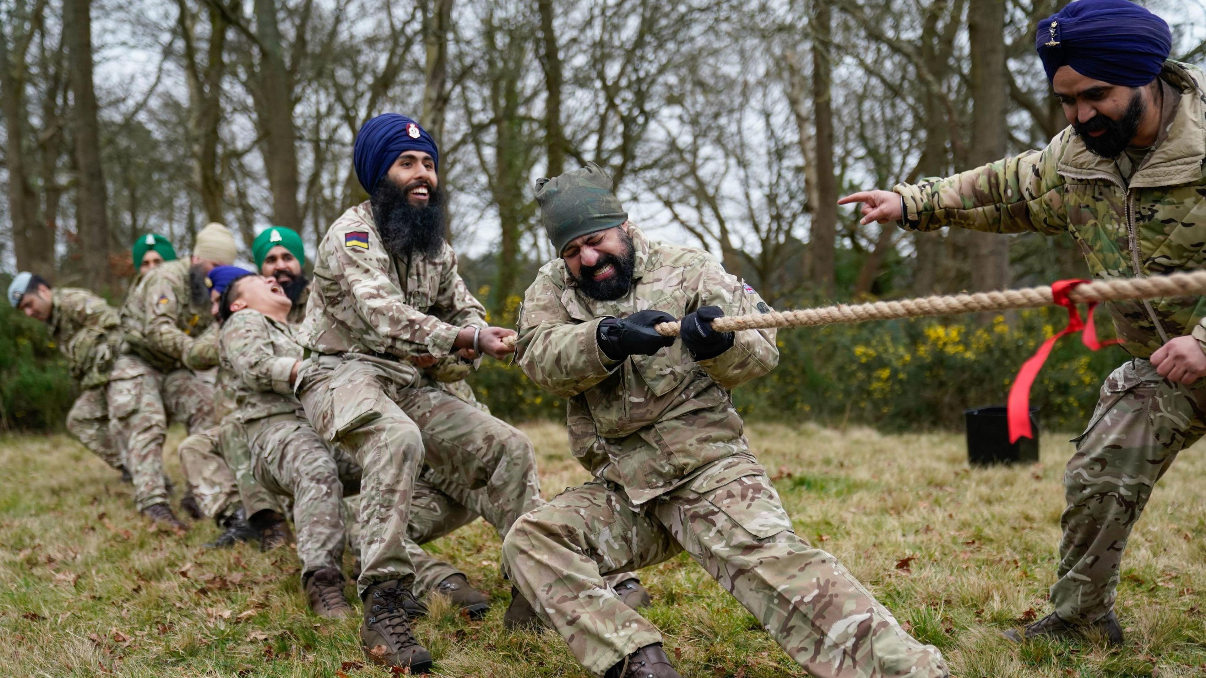 Sikh soldiers of the British Army compete in a tug of war as they take part in the Holla Mahalla Sikh military festival, at the Aldershot Garrison, Hampshire. 