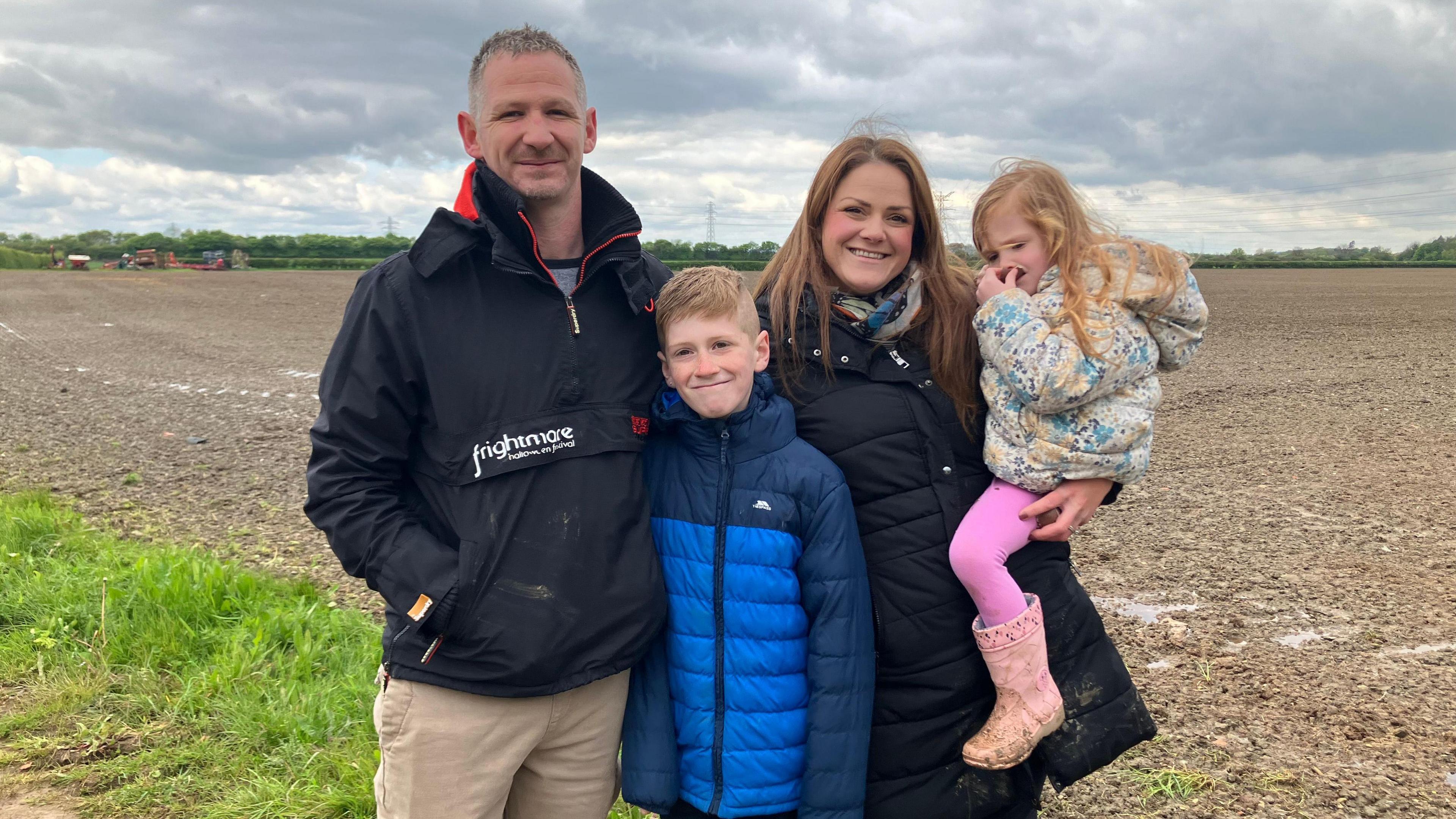 Brodie's family pose for a picture at the site where Brodie found the matrix seal