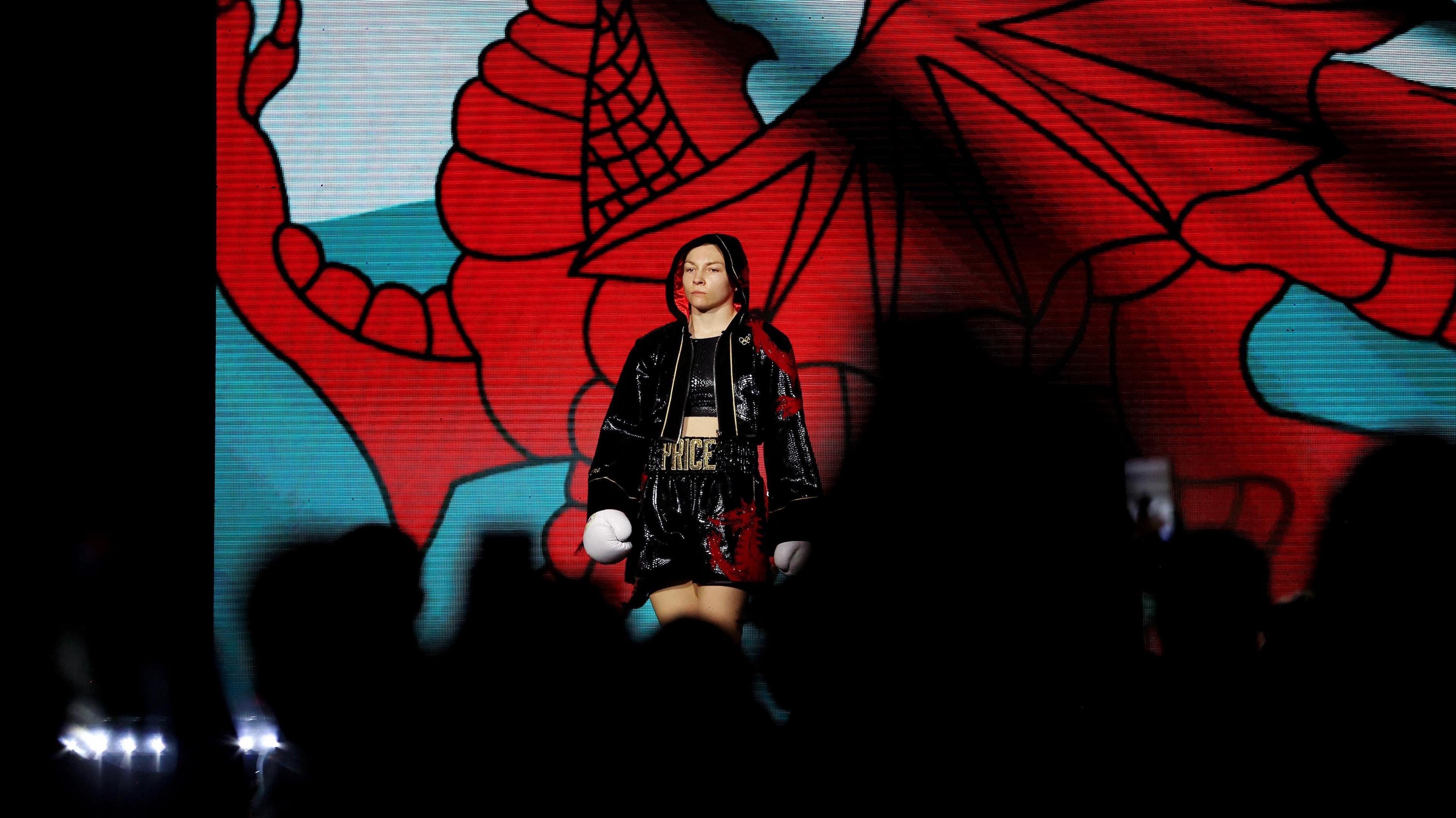 CARDIFF, WALES - MAY 11: Lauren Price looks on as she walks into the arena during her ring walk prior to the IBO and WBA World Welterweight Title fight between Jessica McCaskill and Lauren Price at Utilita Arena Cardiff on May 11, 2024 in Cardiff, Wales. (Photo by James Chance/Getty Images)
