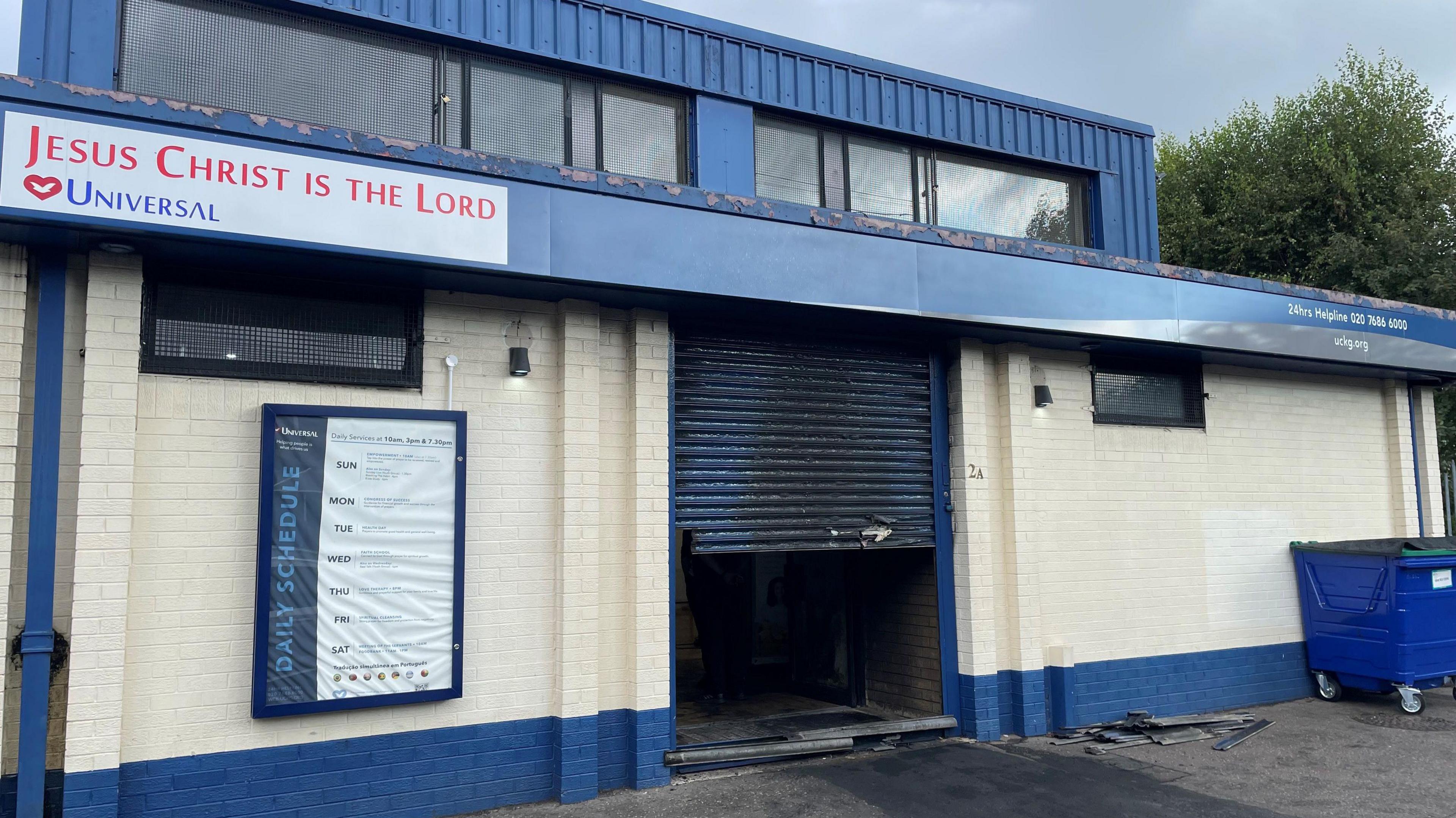 Damaged blue shutter of blue and cream church in Templemore Street in east Belfast