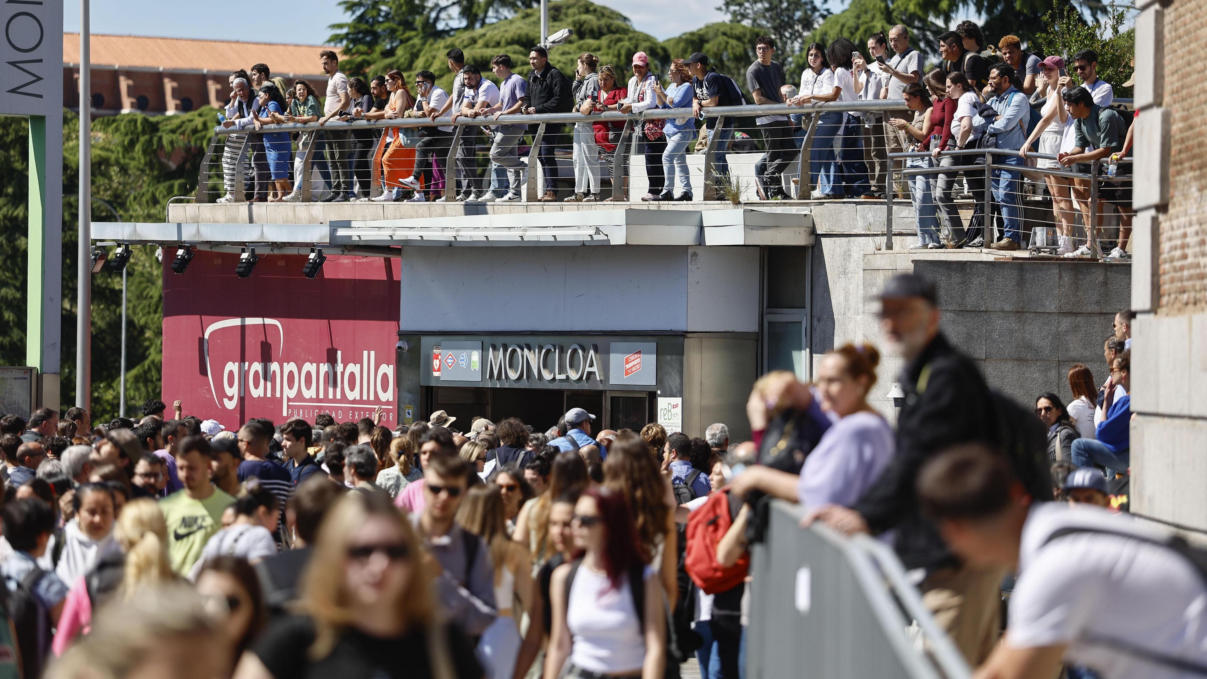 People gather around the Moncloa Transport Interchange after the power outage in Madrid, Spain