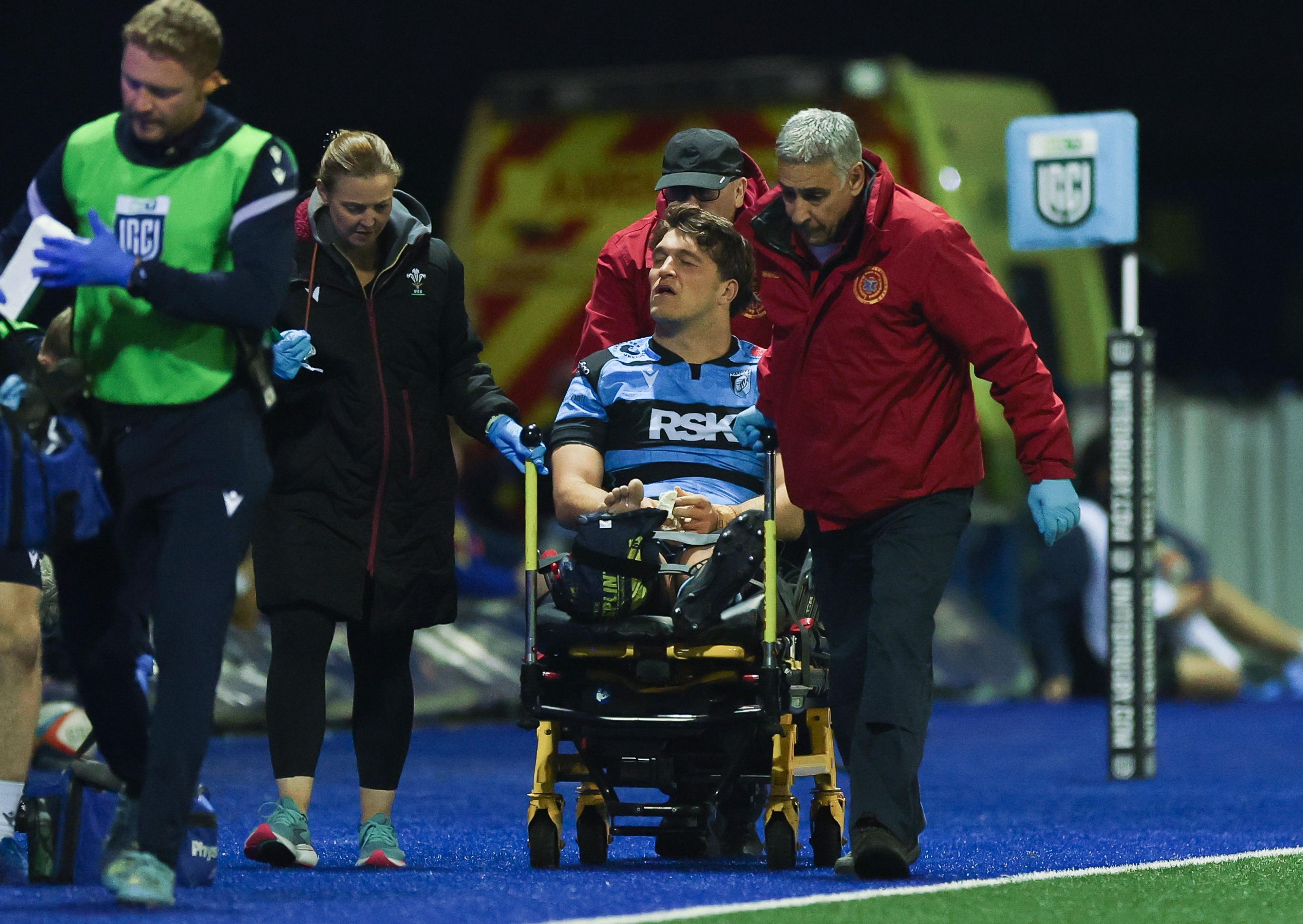 Cardiff lock Teddy Williams is stretchered off after an ankle injury against Connacht