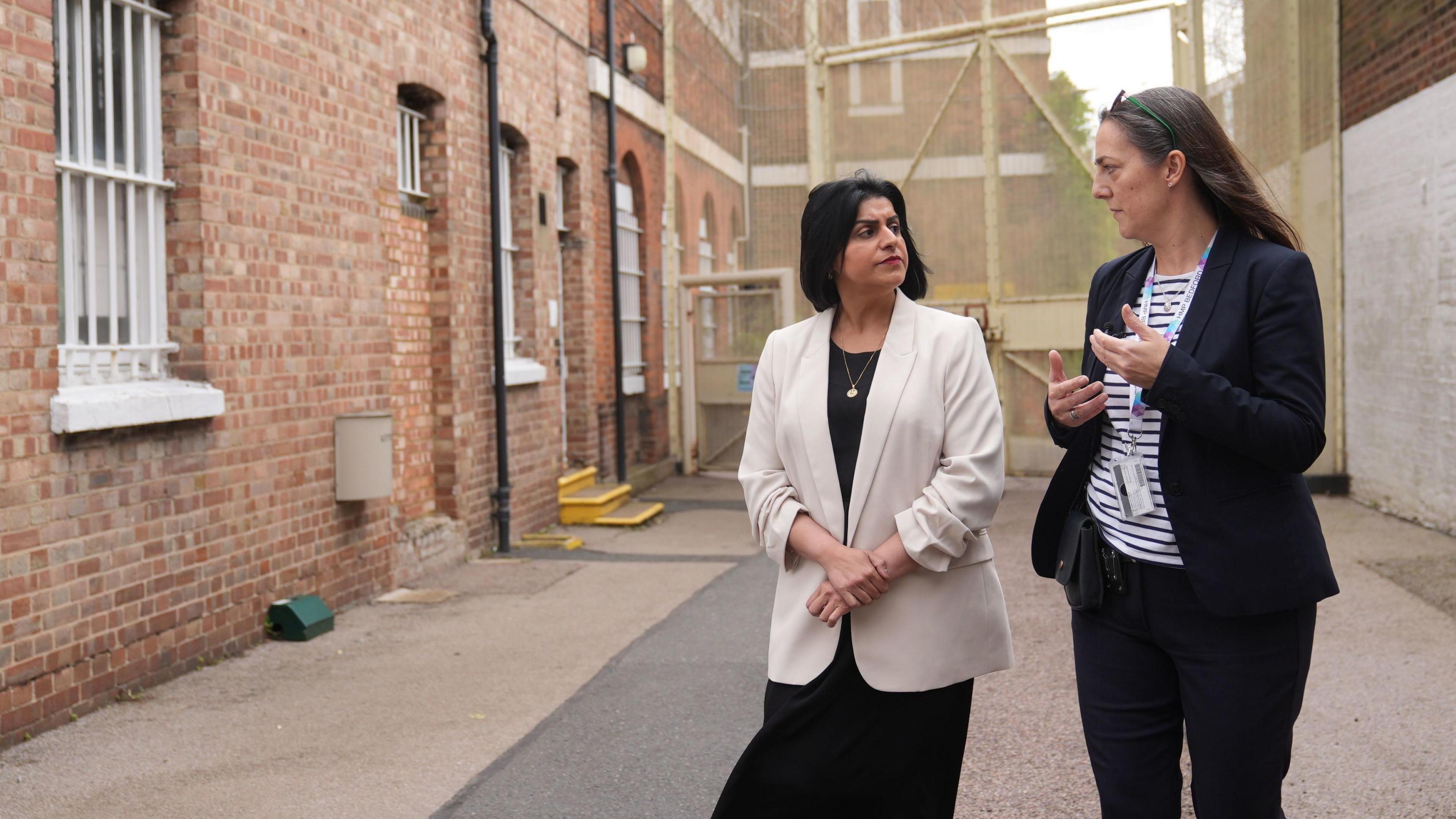 Shabana Mahmood, the Justice Secretary, on a prison visit with a prison officer.  