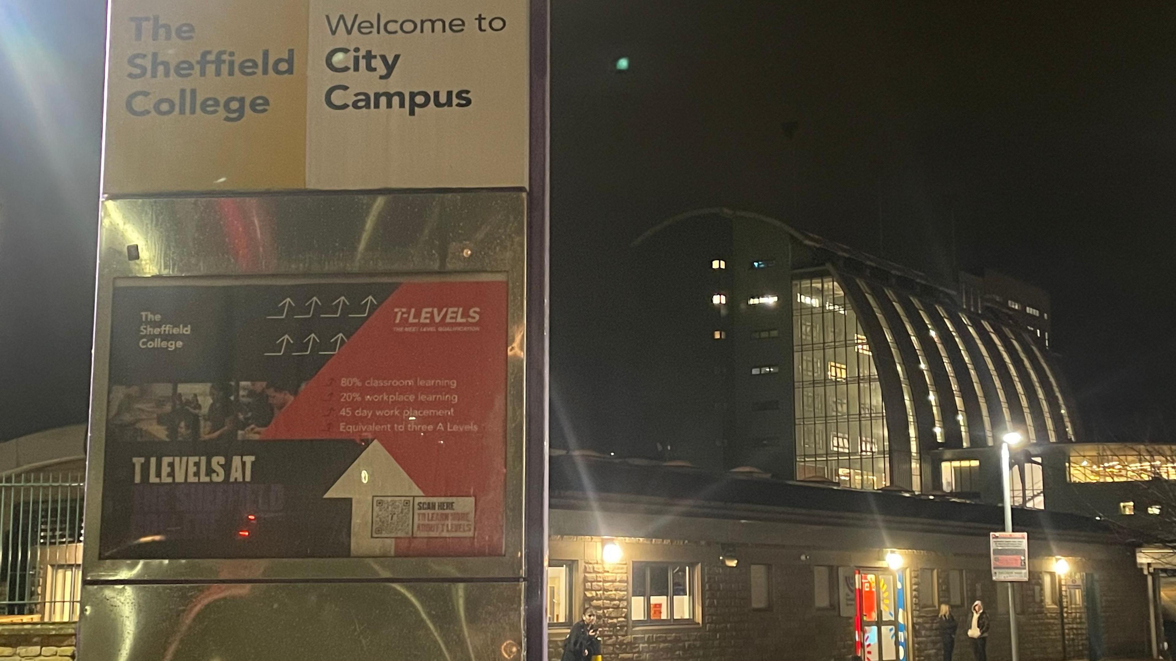 Exterior shot of Sheffield City College, with signs saying City Campus, and stone, glass and steel buildings behind.