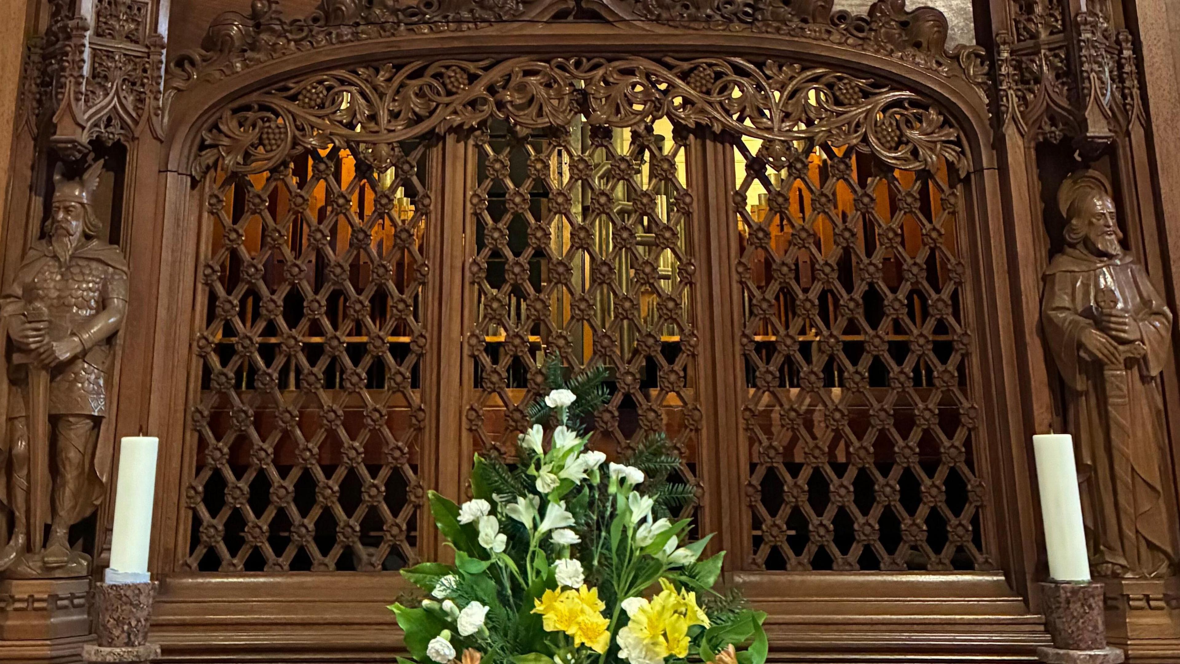 Hidden behind a decorative screen designed by Scottish architect George Mackie Watson, the pipes are only half visible to visitors of the cathedral.