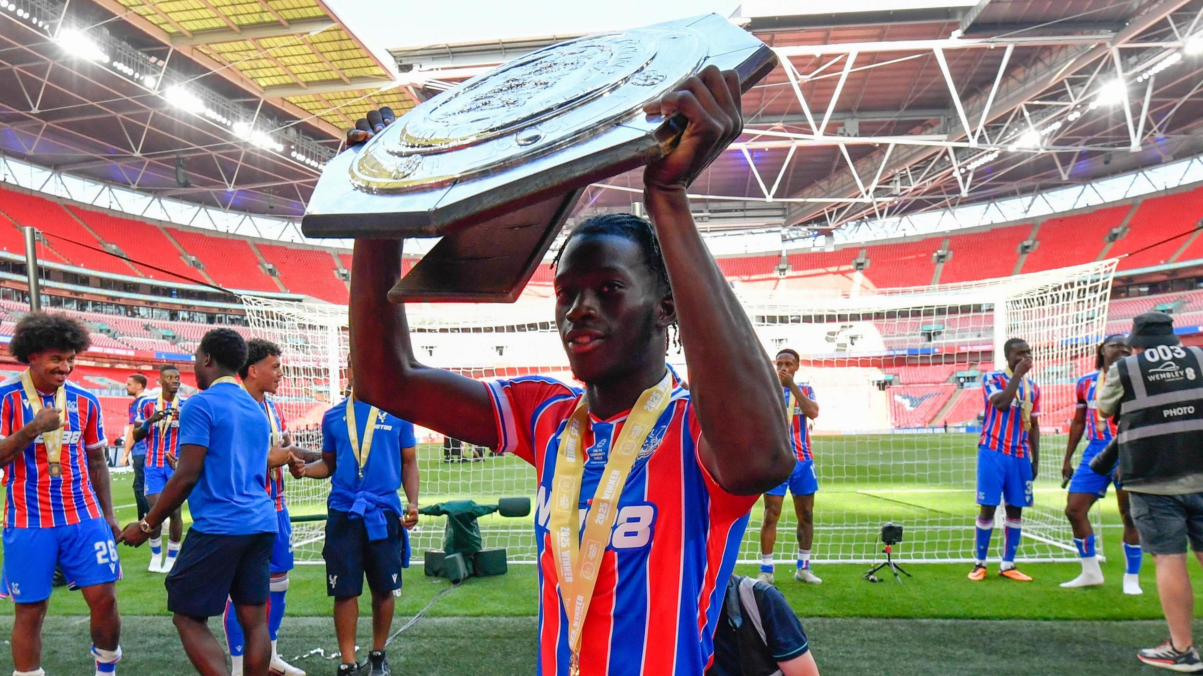 Romain Esse celebrates after winning the Community Shield with Crystal Palace