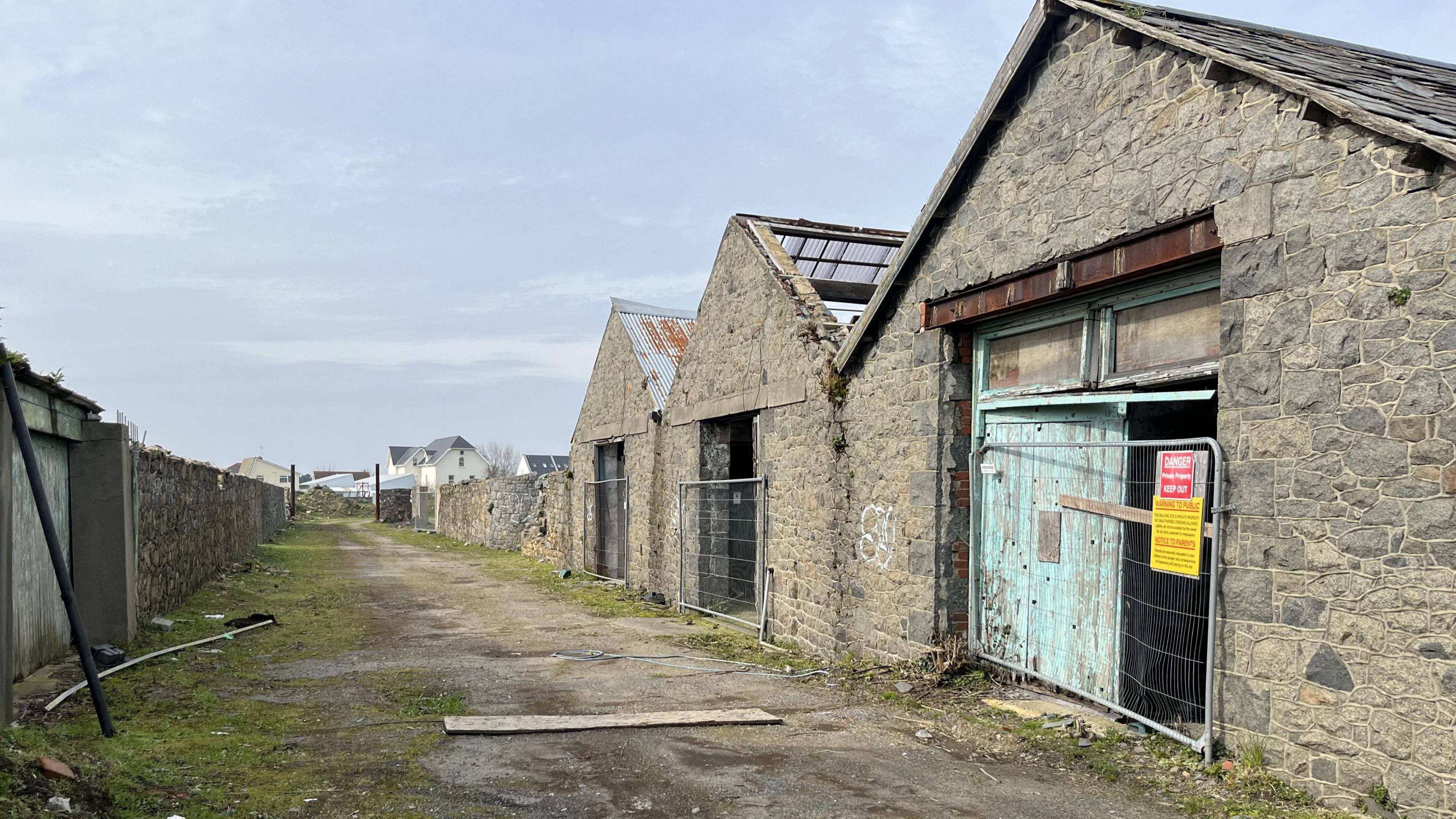 A series of derelict industrial buildings