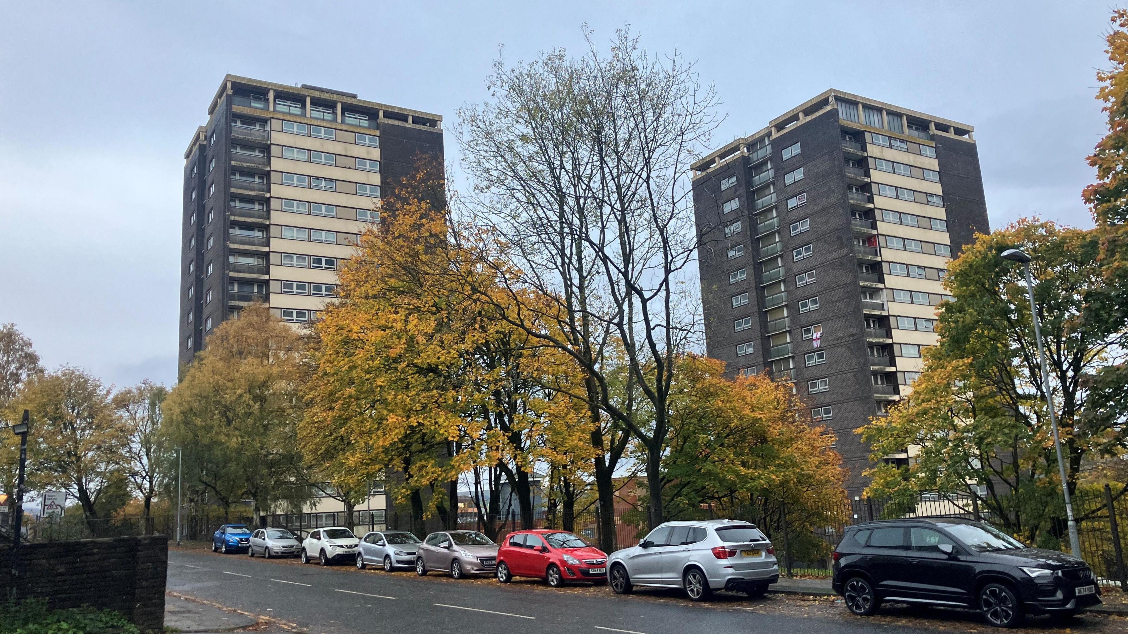 Photograph of two of the seven sisters tower blocks on the College Bank estate in Rochdale.