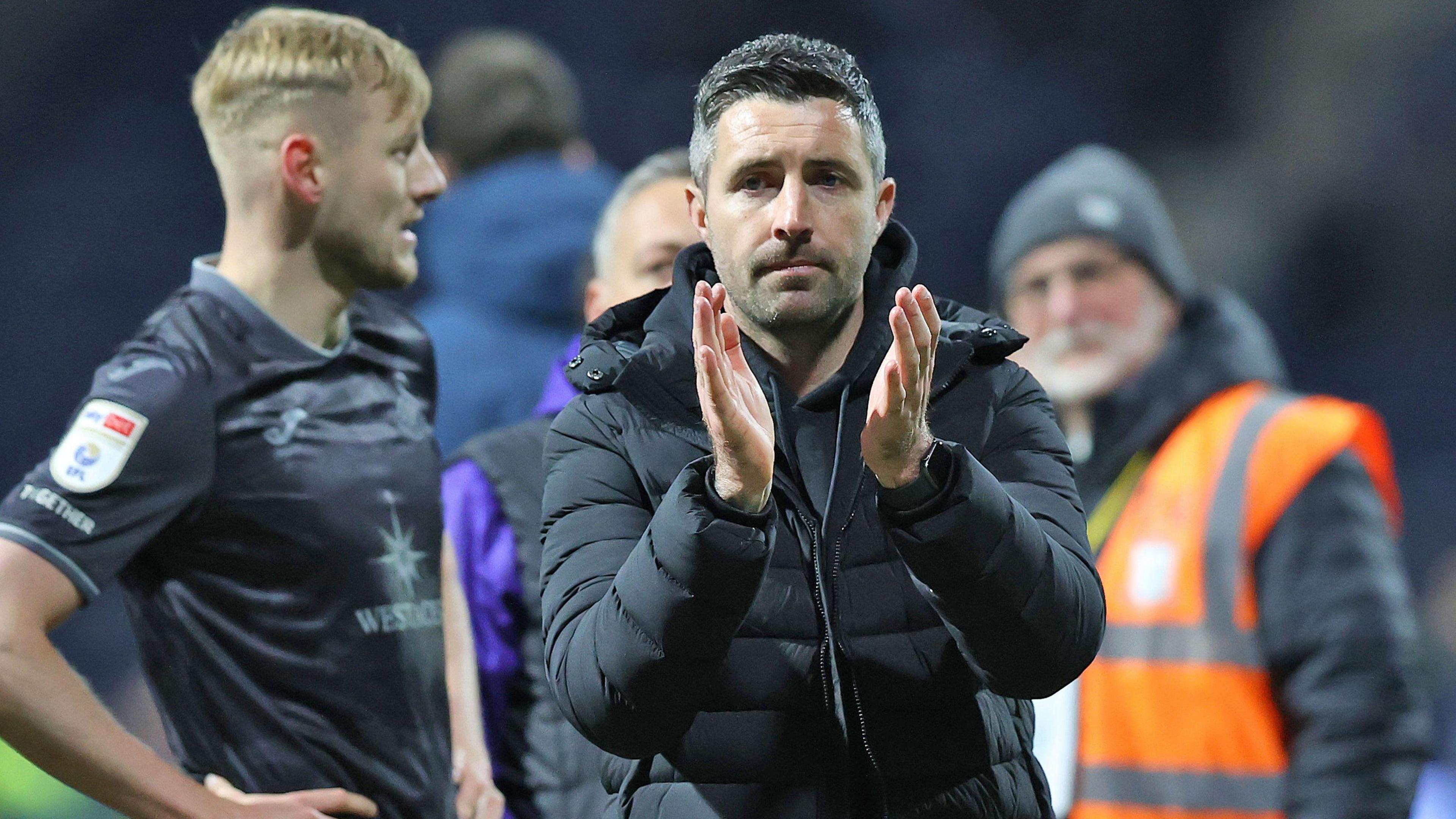 Alan Sheehan applauds Swansea fans at Preston