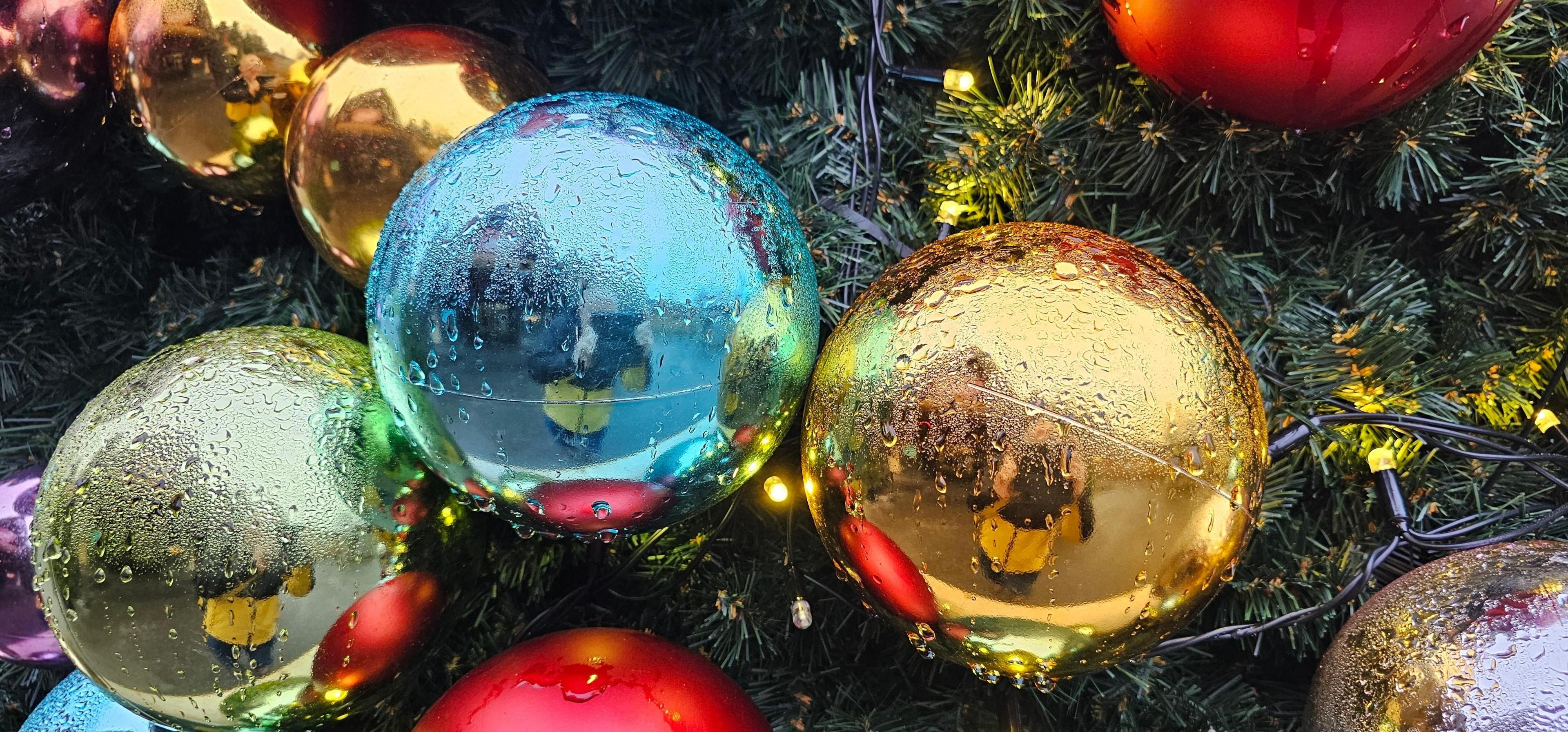 Close-up of blue, red and golden coloured Christmas baubles in Summerhill, Worcestershire