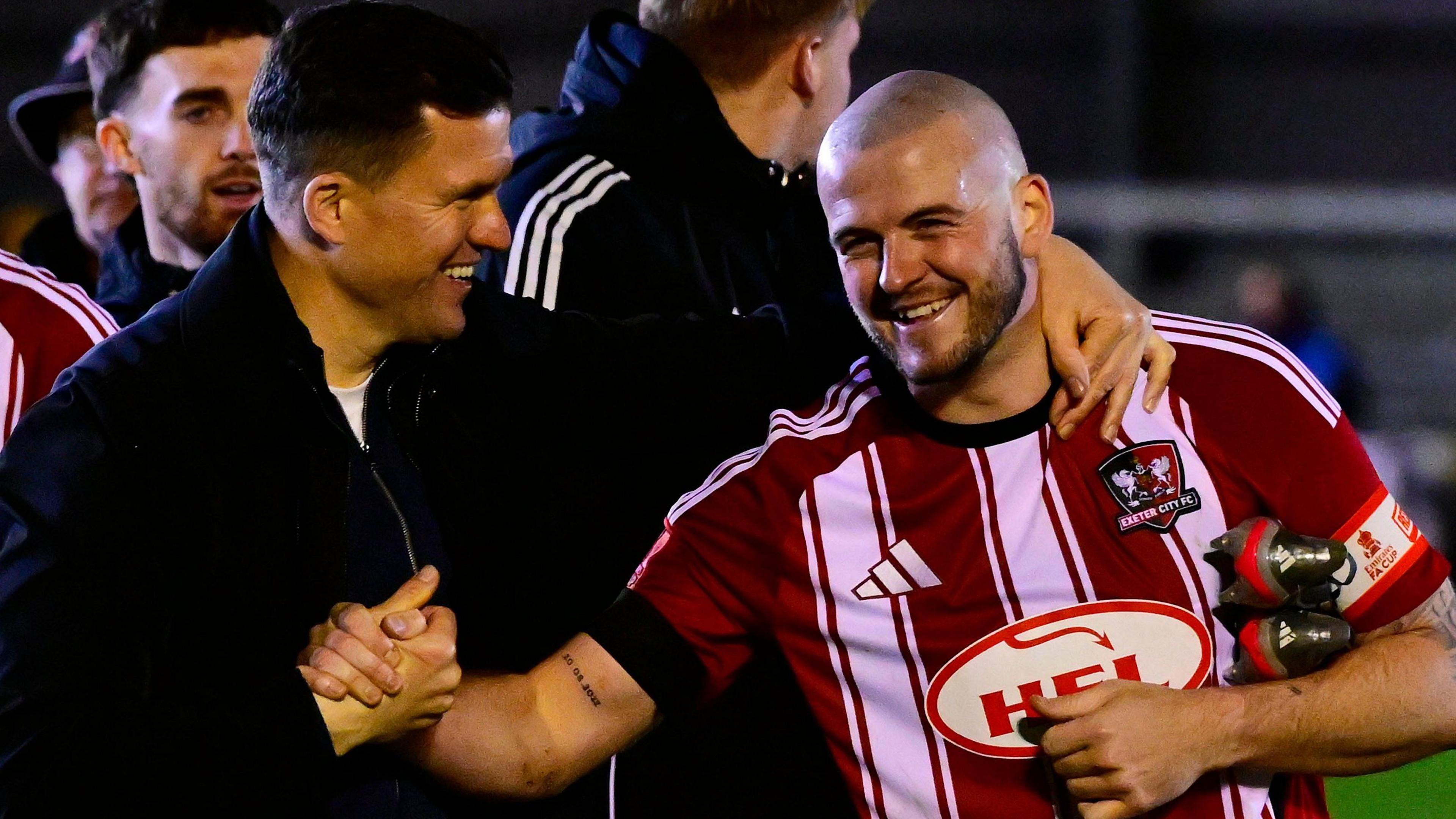 Gary Caldwell and Pierce Sweeney embrace 