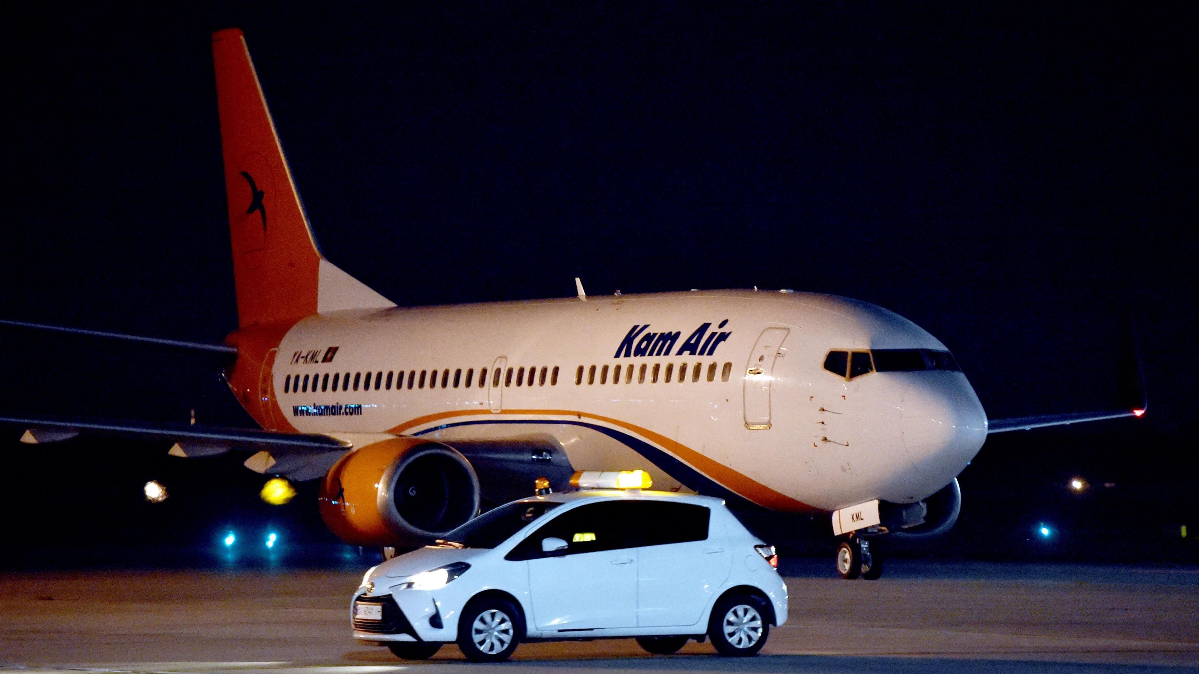 A Boeing 737-31S Kam Air passenger plane with people evacuated from Afghanistan on board, lands at Boryspil International Airport outside Kiev, on August 23, 2021