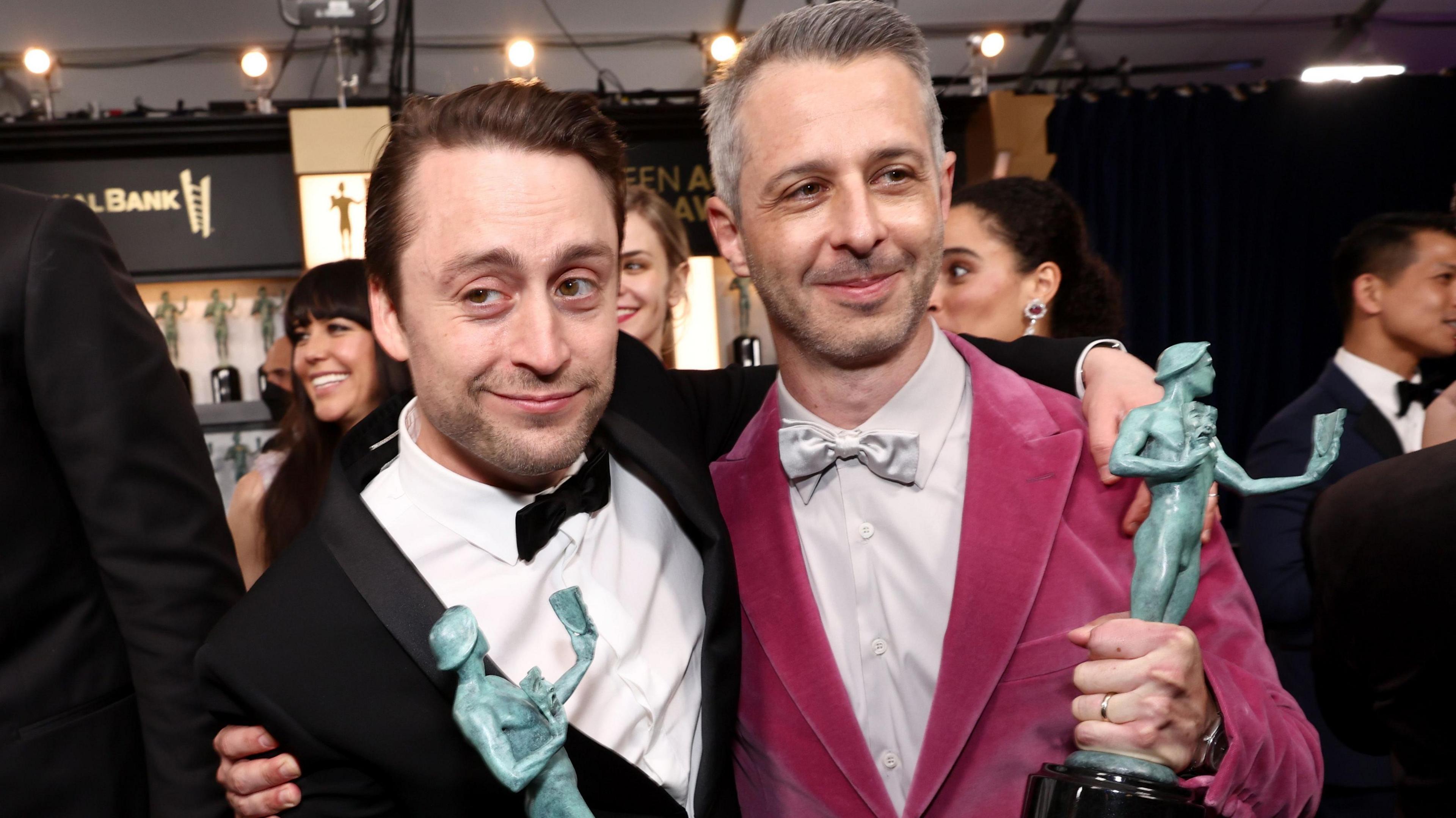 Kieran Culkin and Jeremy Strong attend the 28th Screen Actors Guild Awards in Santa Monica, California, on 27 February 2022. Culkin is wearing a black tux, Strong's tux is pink velvet.