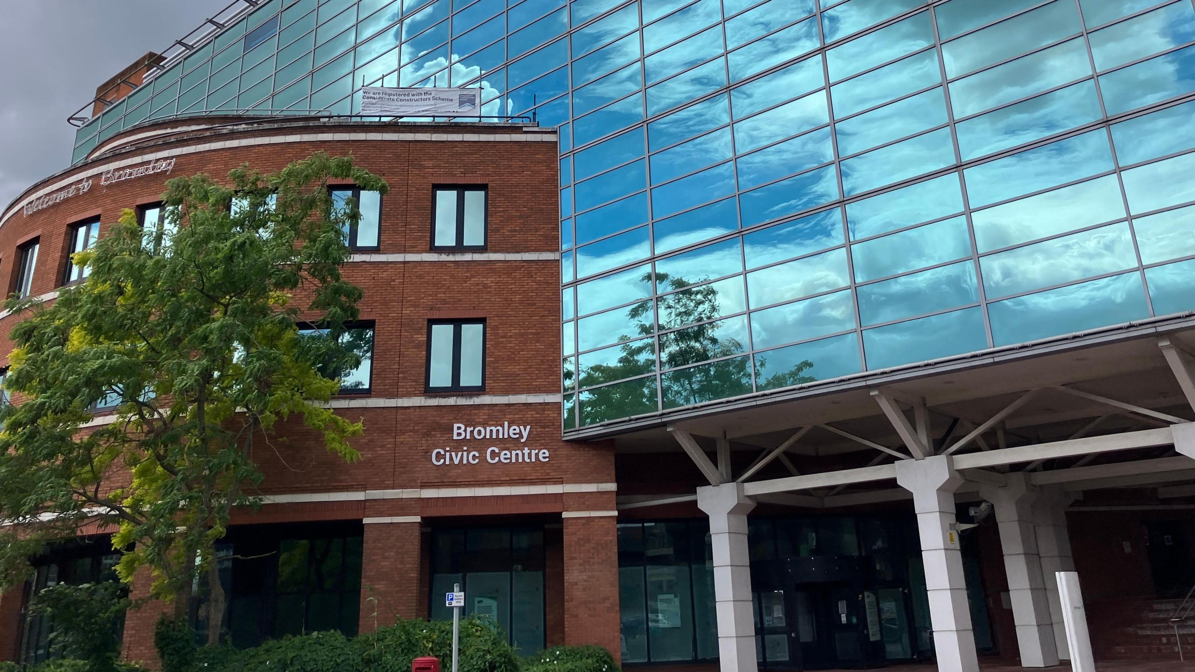 A modern office block with a sign on the front that says Bromley Civic Centre.