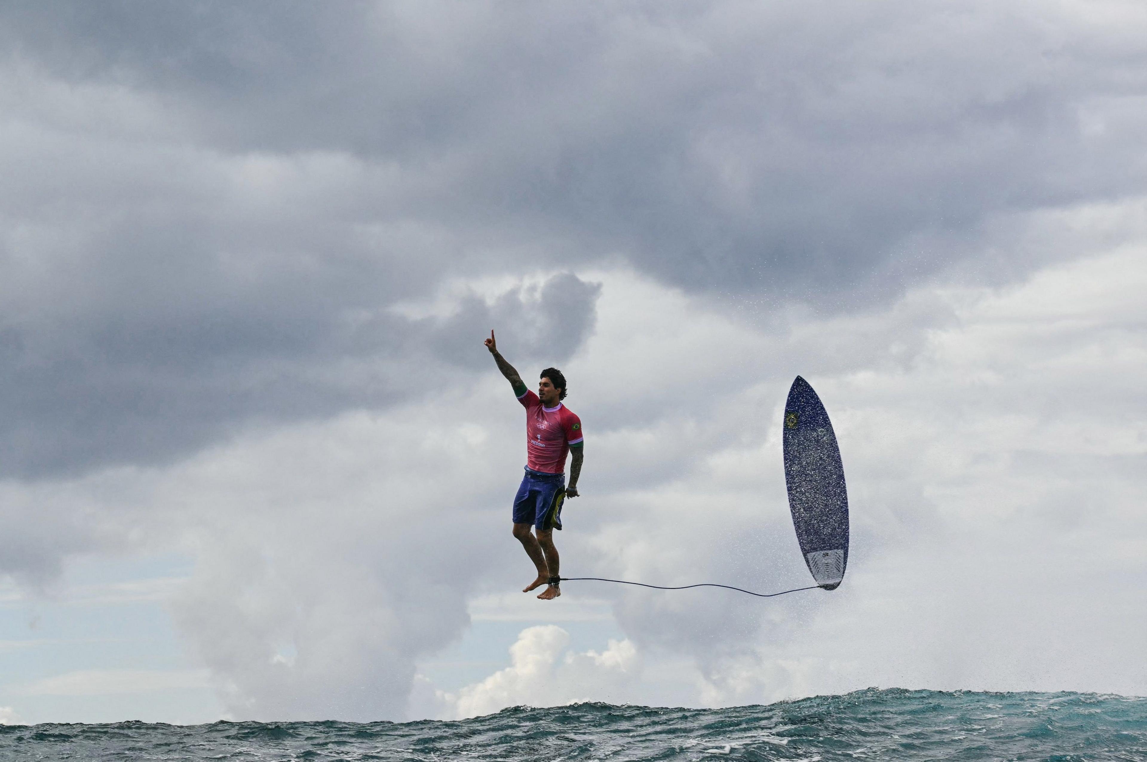 Brazil's Gabriel Medina reacts after catching a wave in the men's surfing at the Paris 2024 Olympics in Teahupo'o, Tahiti