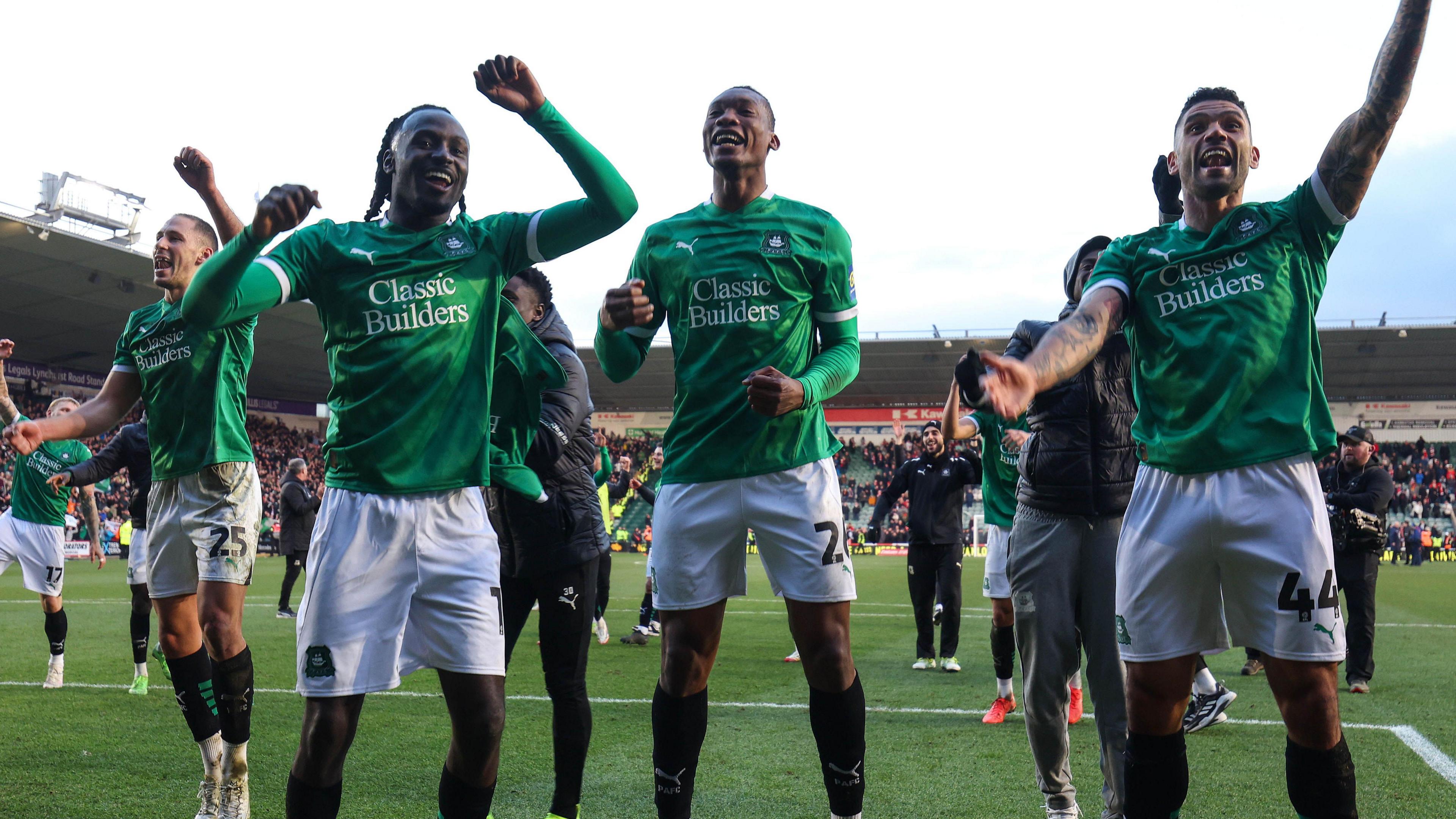 Plymouth Argyle players celebrate beating Liverpool