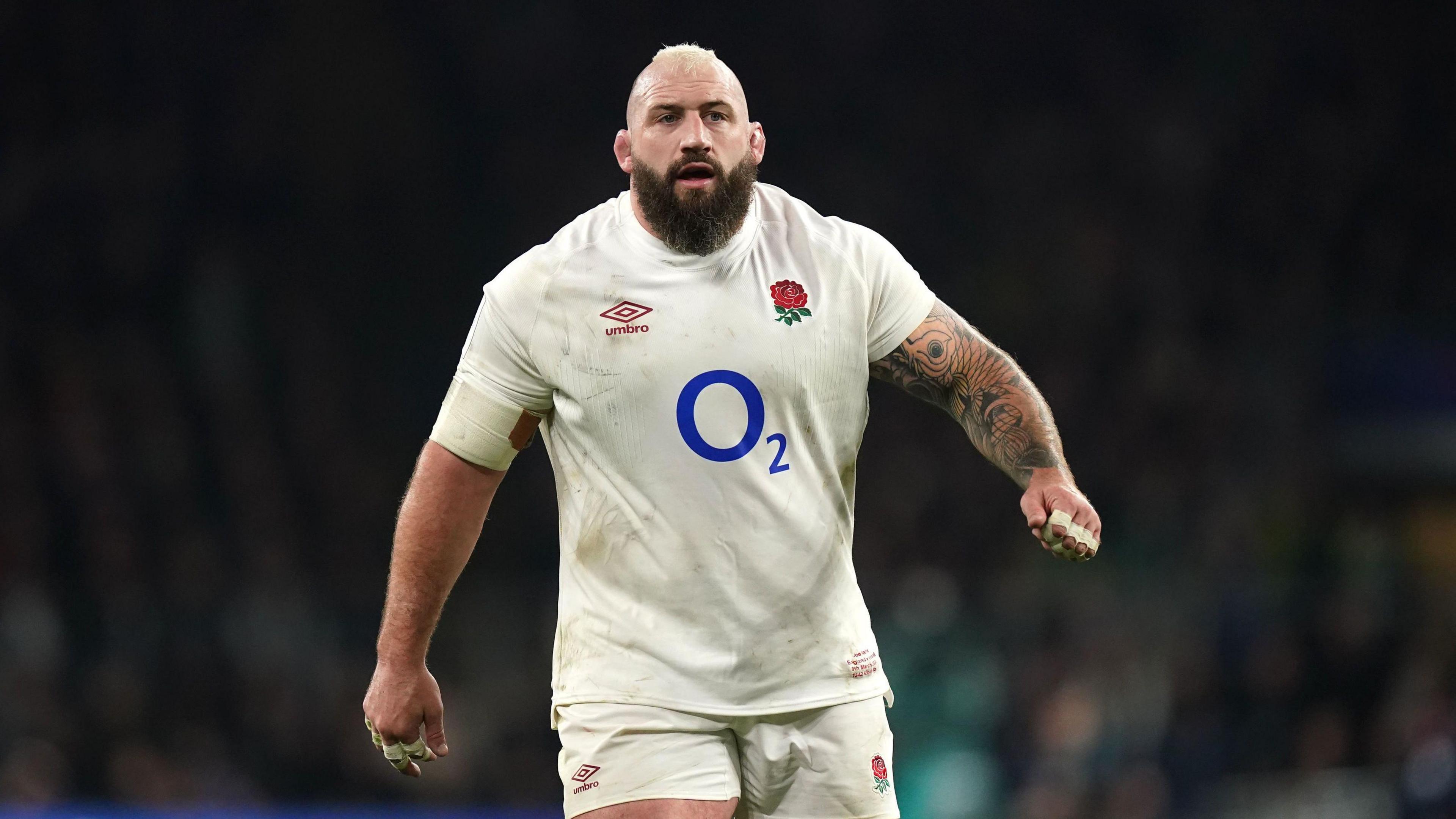 A close up image of Joe Marler in white England kit
