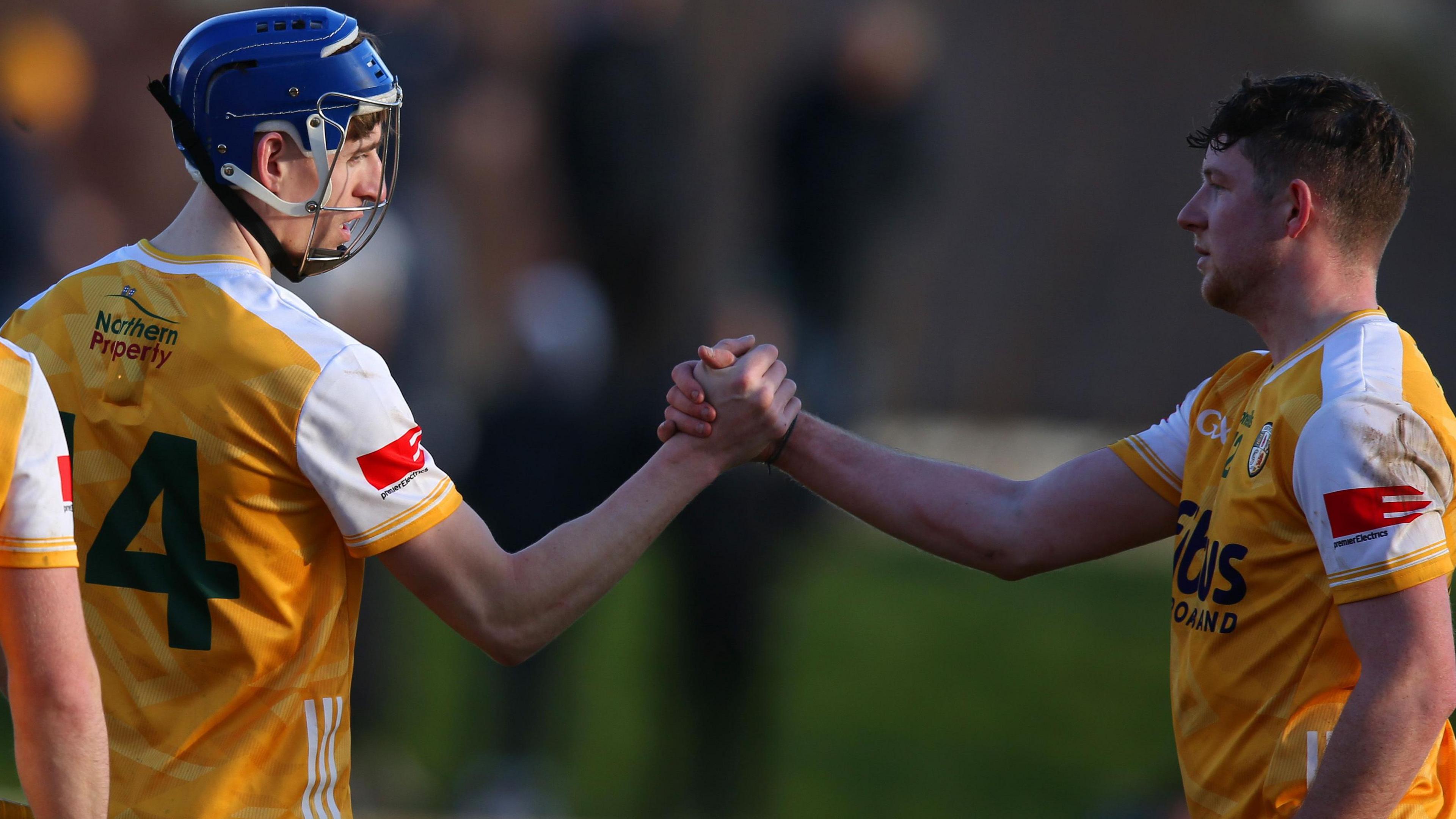 Antrim players James McNaughton and Keelan Molloy shake hands after Antrim's win over Westmeath