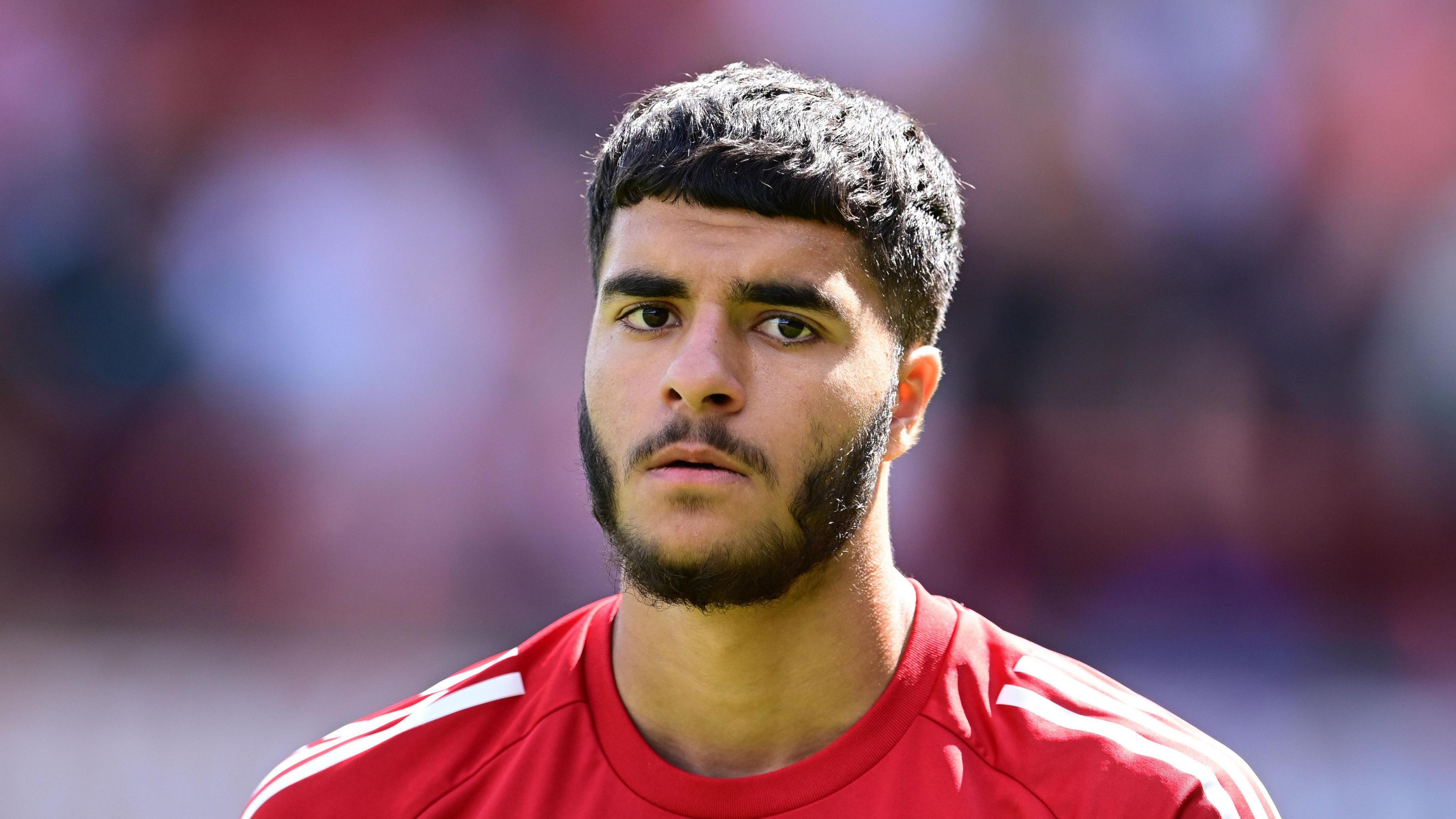 Botan Ameen standing on the pitch during a match for Swindon