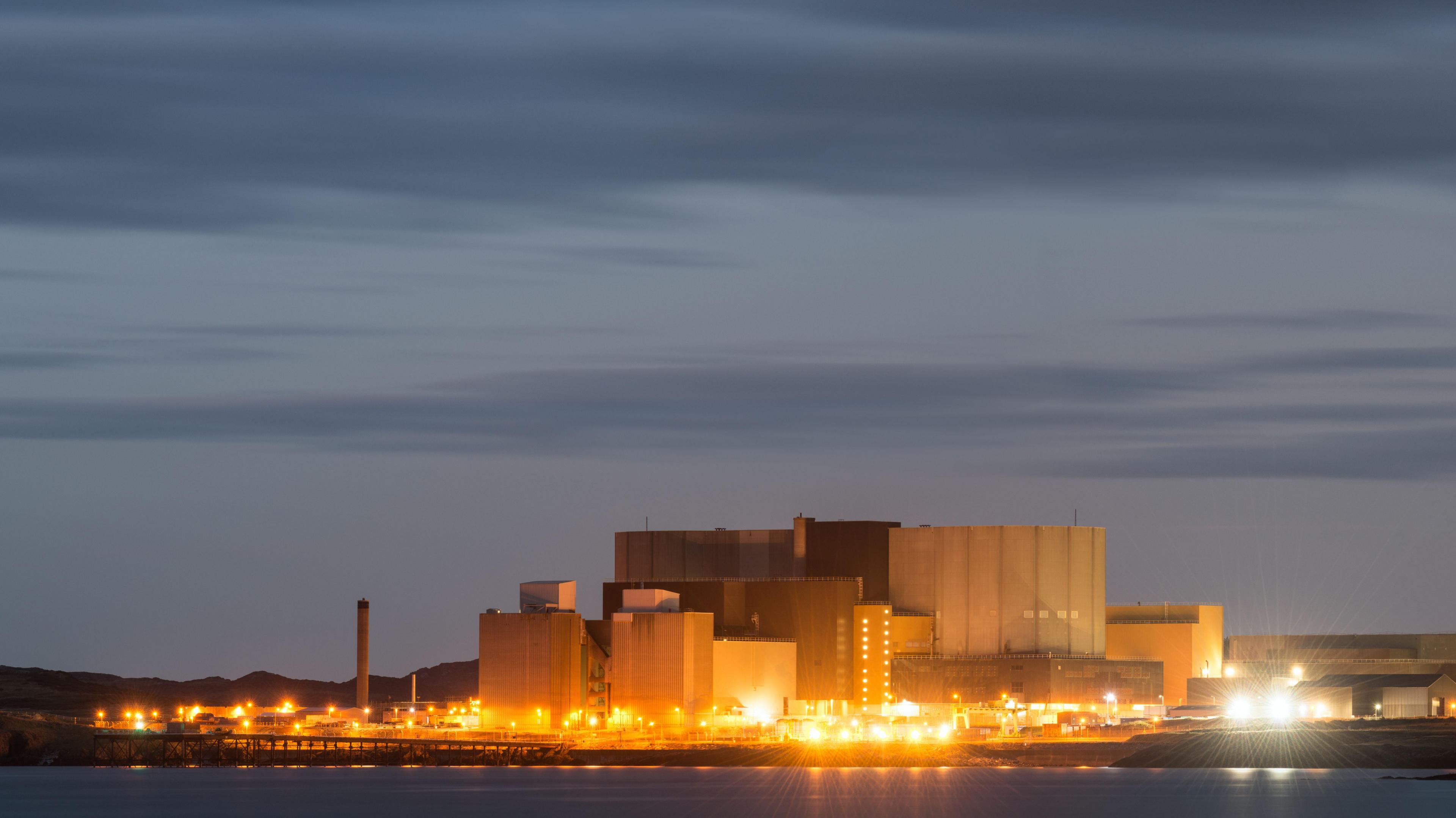 A panoramic view of Wylfa nuclear power station on Anglesey in North Wales at twilight.