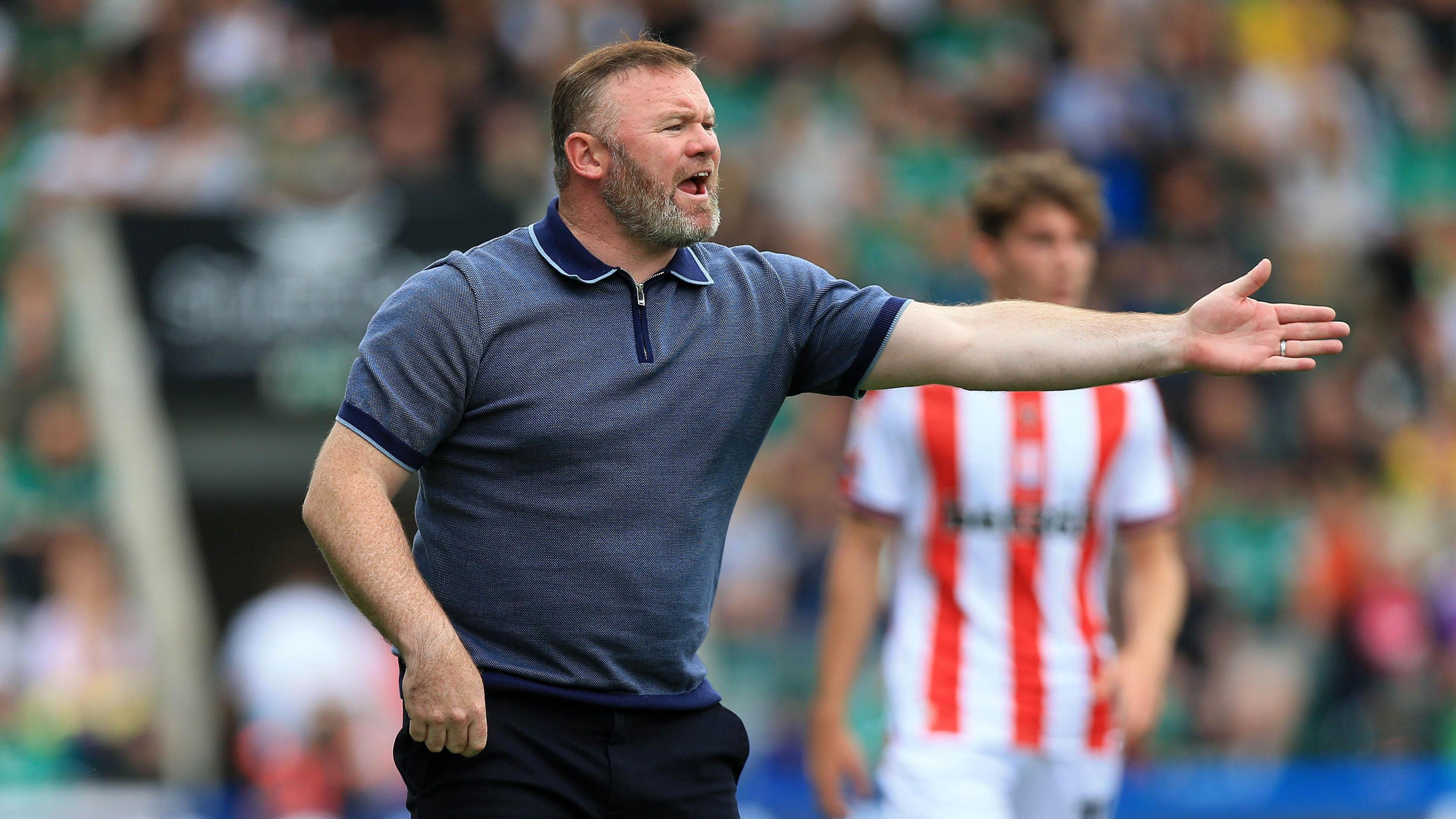 Plymouth boss Wayne Rooney gesticulates from the technical area at Home Park