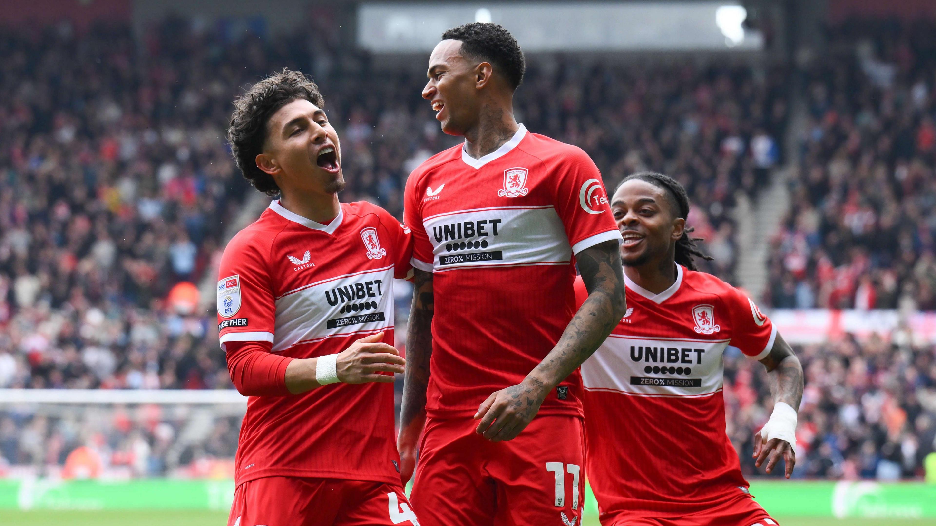 Morgan Whittaker celebrates his first goal against Watford with Jeremy Sarmiento (left) and Sontje Hansen (right, just behind him) 