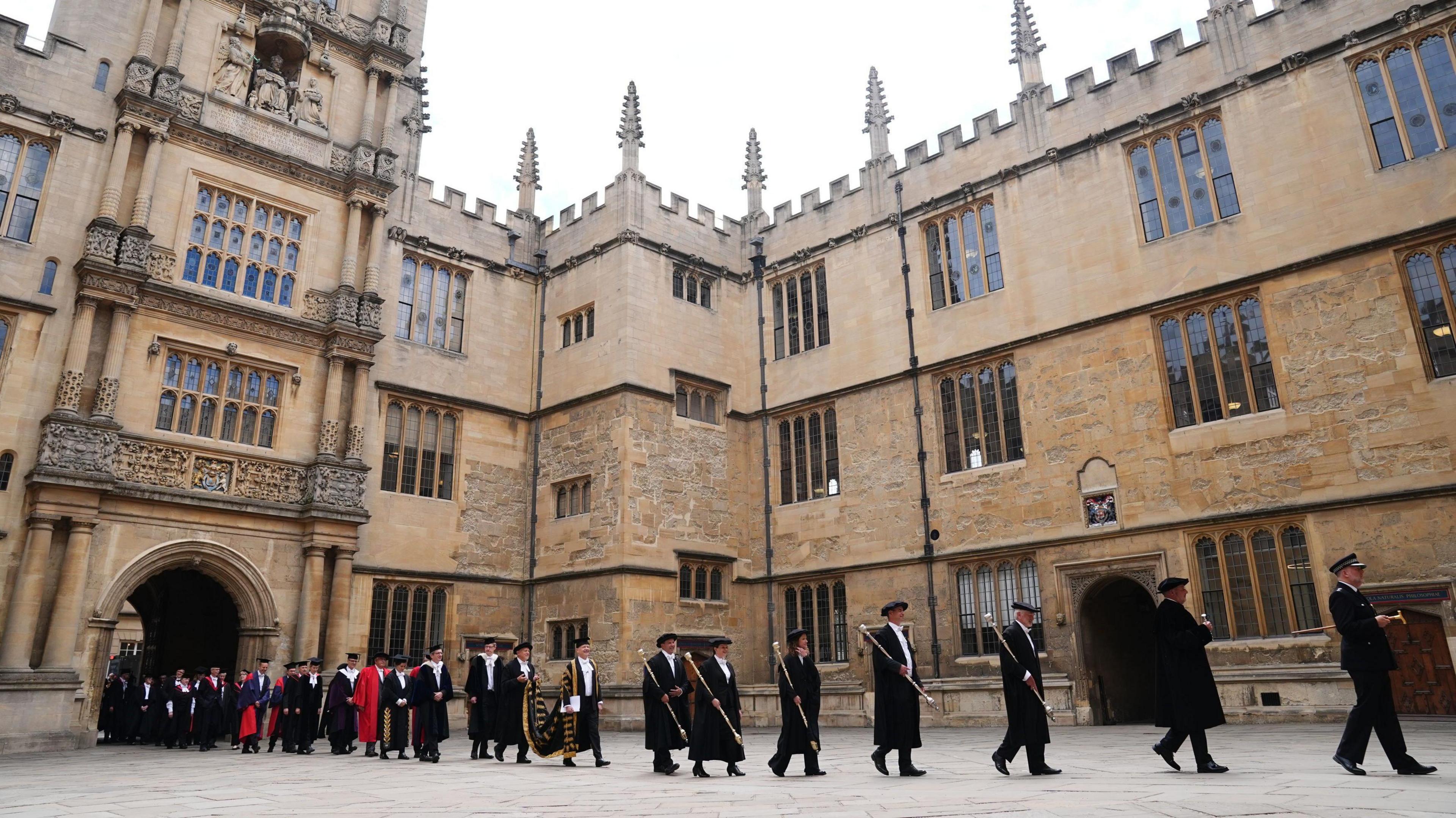 Bedels lead a procession towards the Sheldonian Theatre, ahead of Oxford University's annual Encaenia Ceremony where award honorary degrees will awarded.