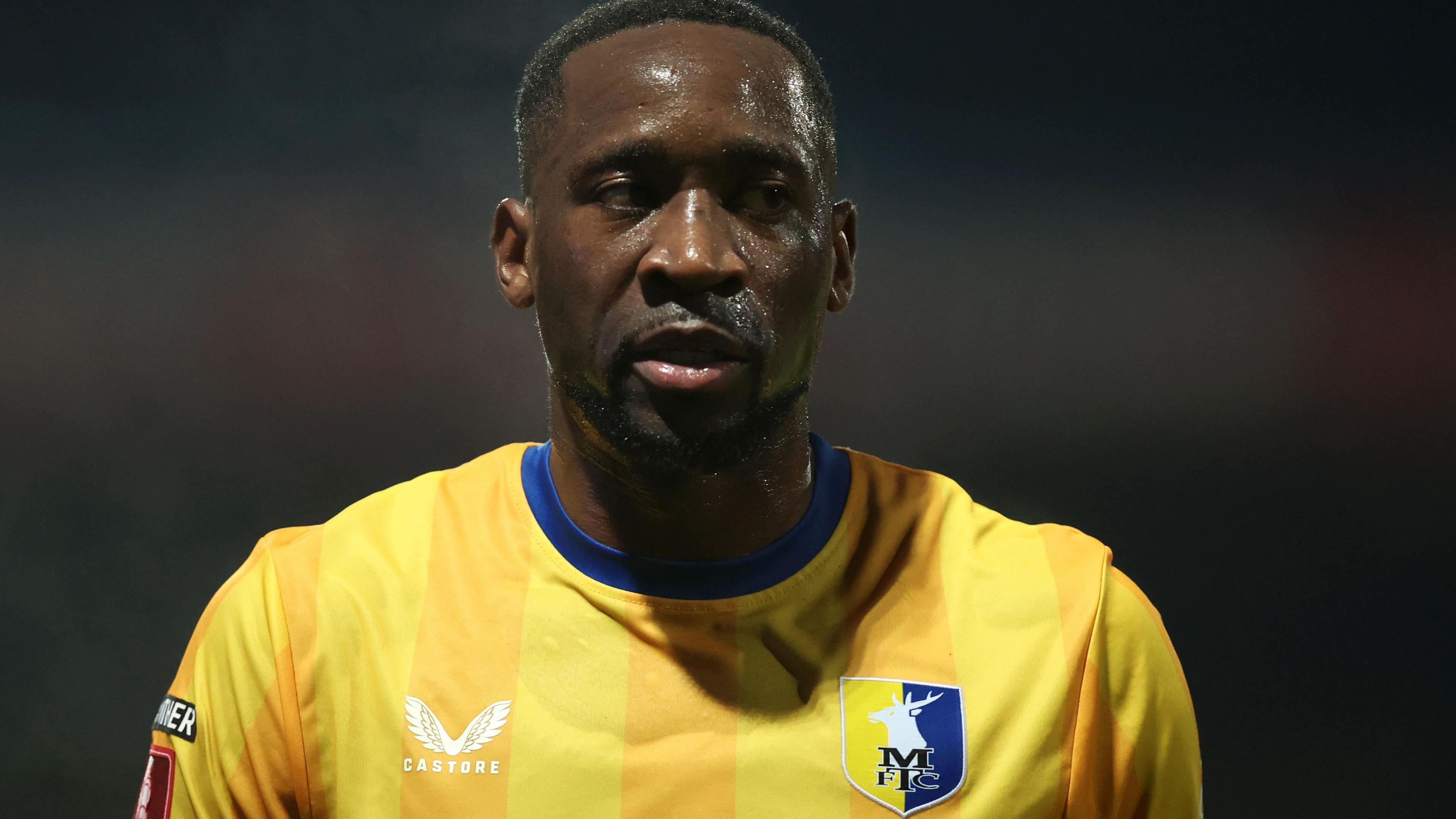 Lucas Akins successful action for Mansfield Town