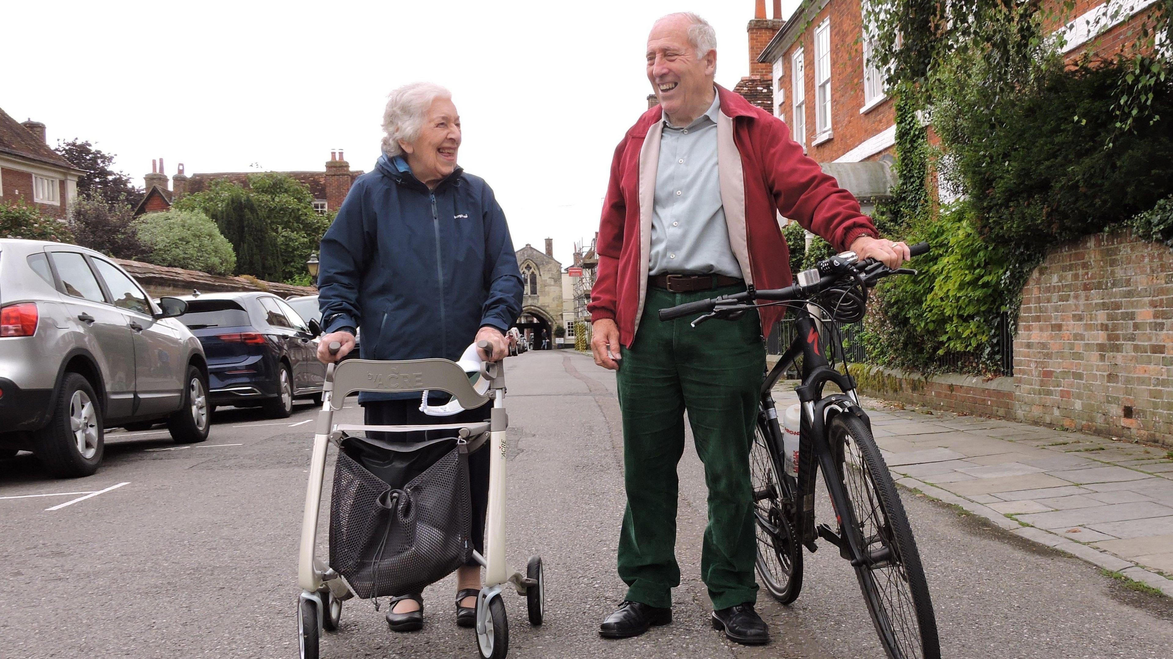 Phyll with and Sven Hocking, the mayor of Salisbury walking down a residential street