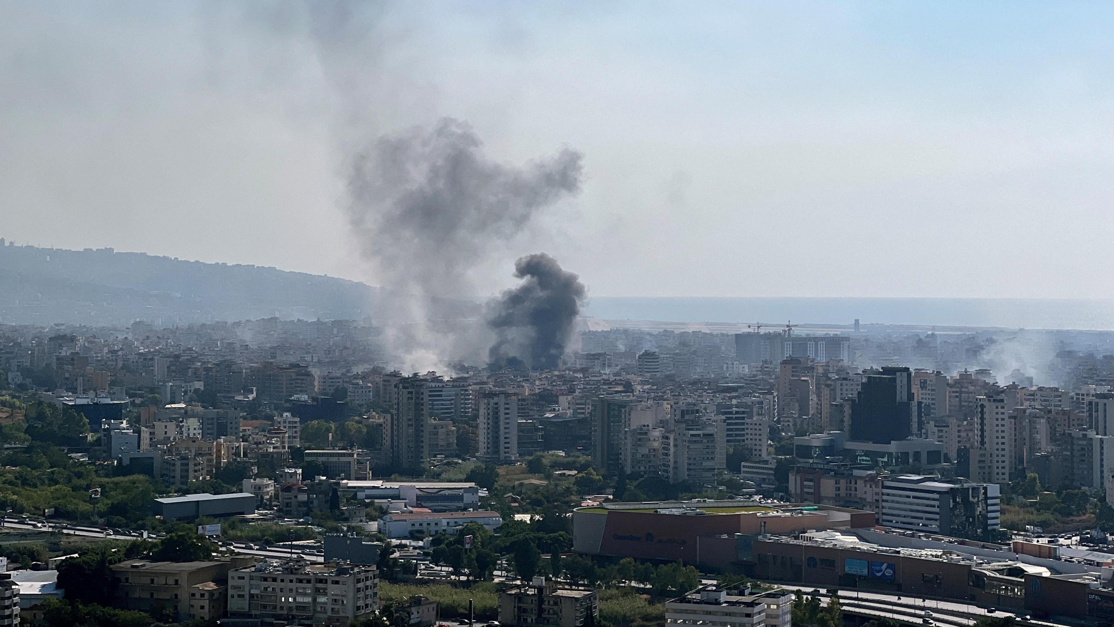 Smoke rises over buildings in Beirut