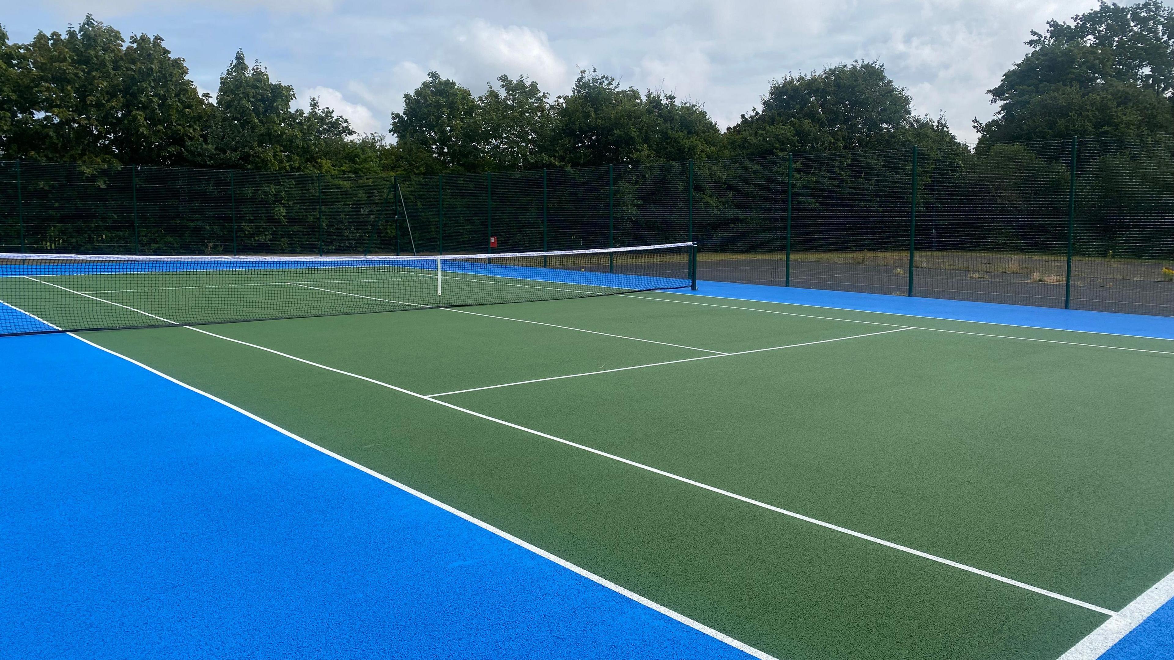 Immaculate new green tennis court at West Byfleet Recreation Ground