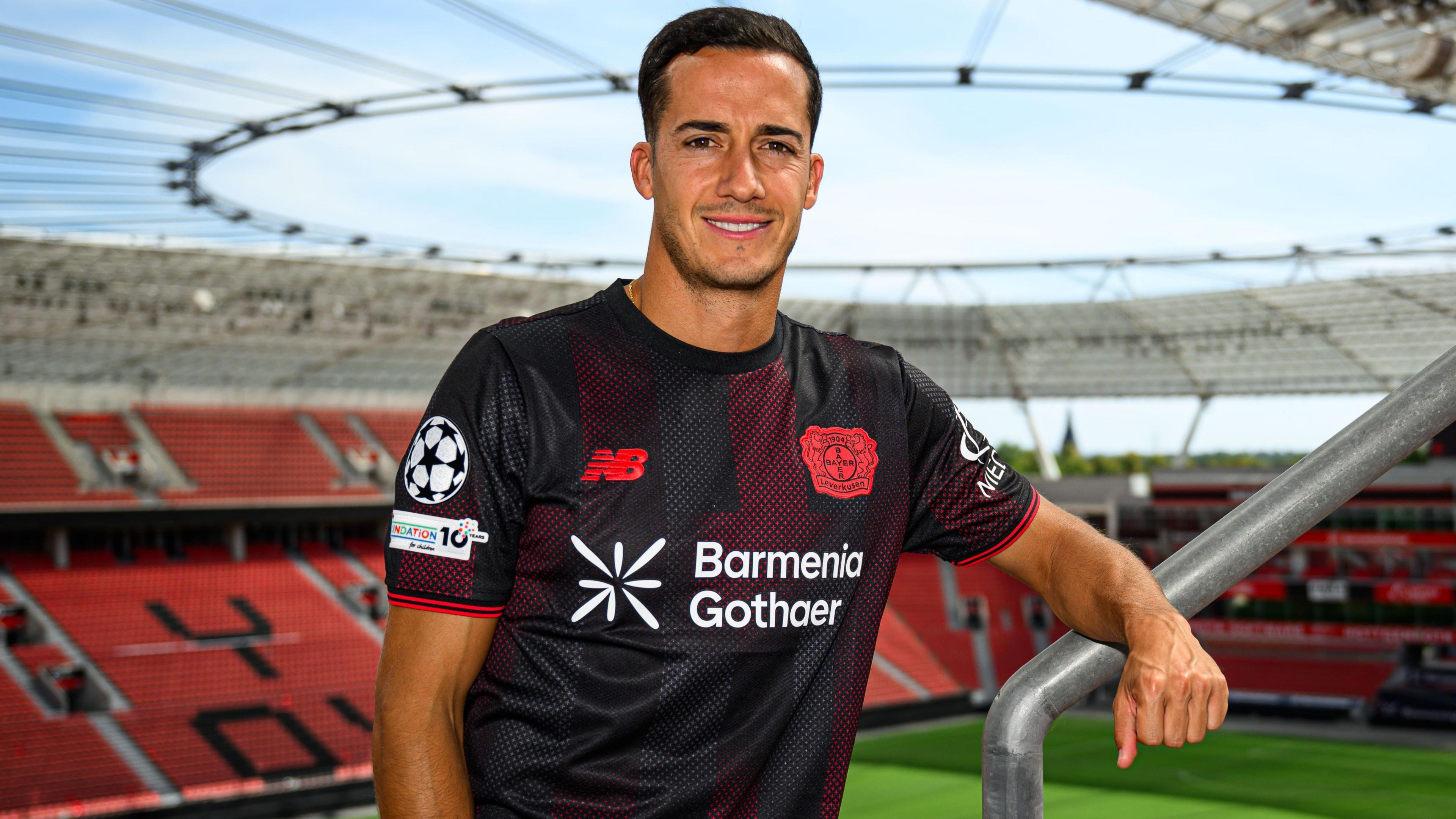 Lucas Vazquez poses for a photo during his signing presentation at the BayArena 
