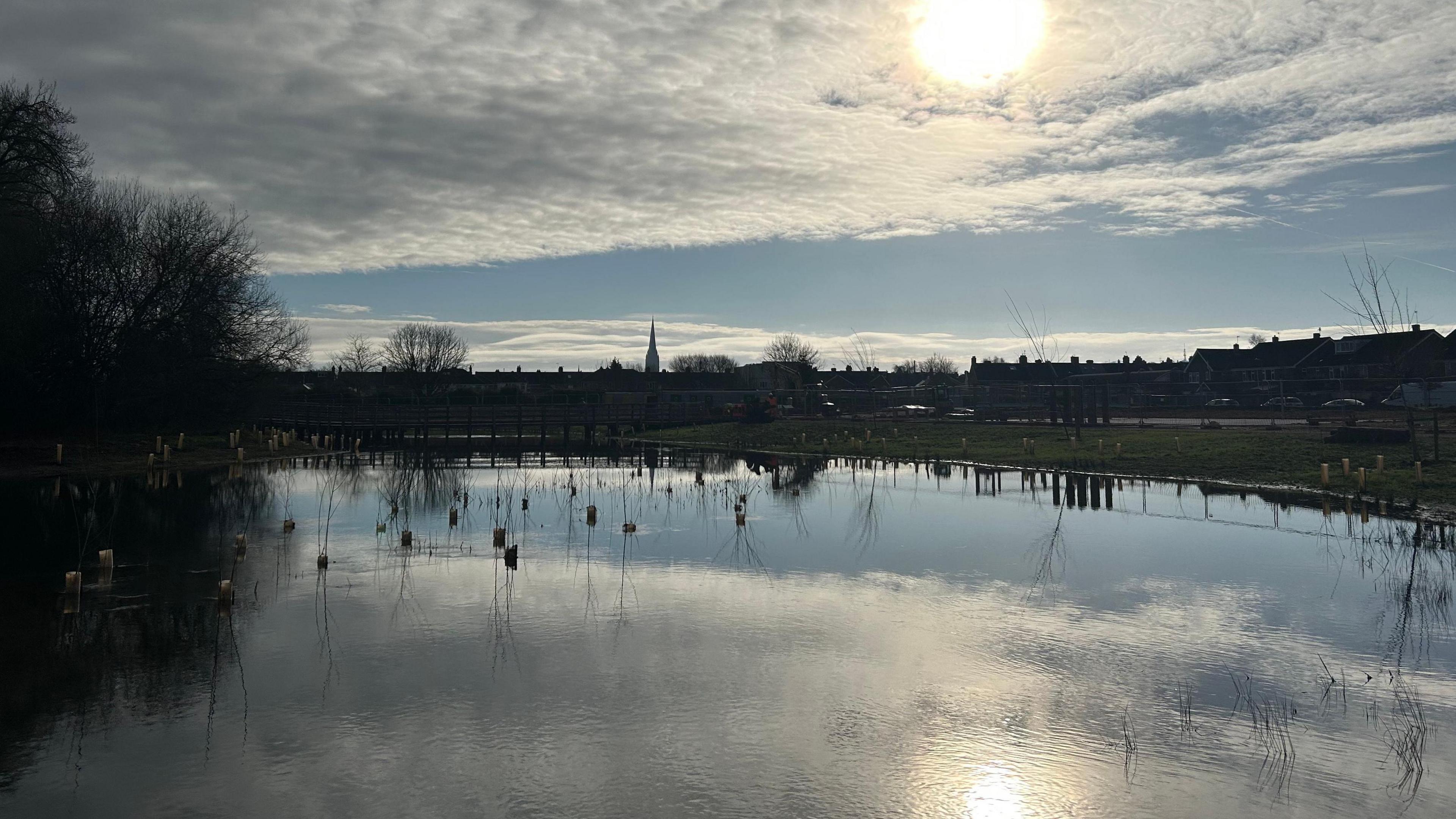 A wetland which is part of the River Avon. The Salisbury Cathedral spire can be seen in the background.