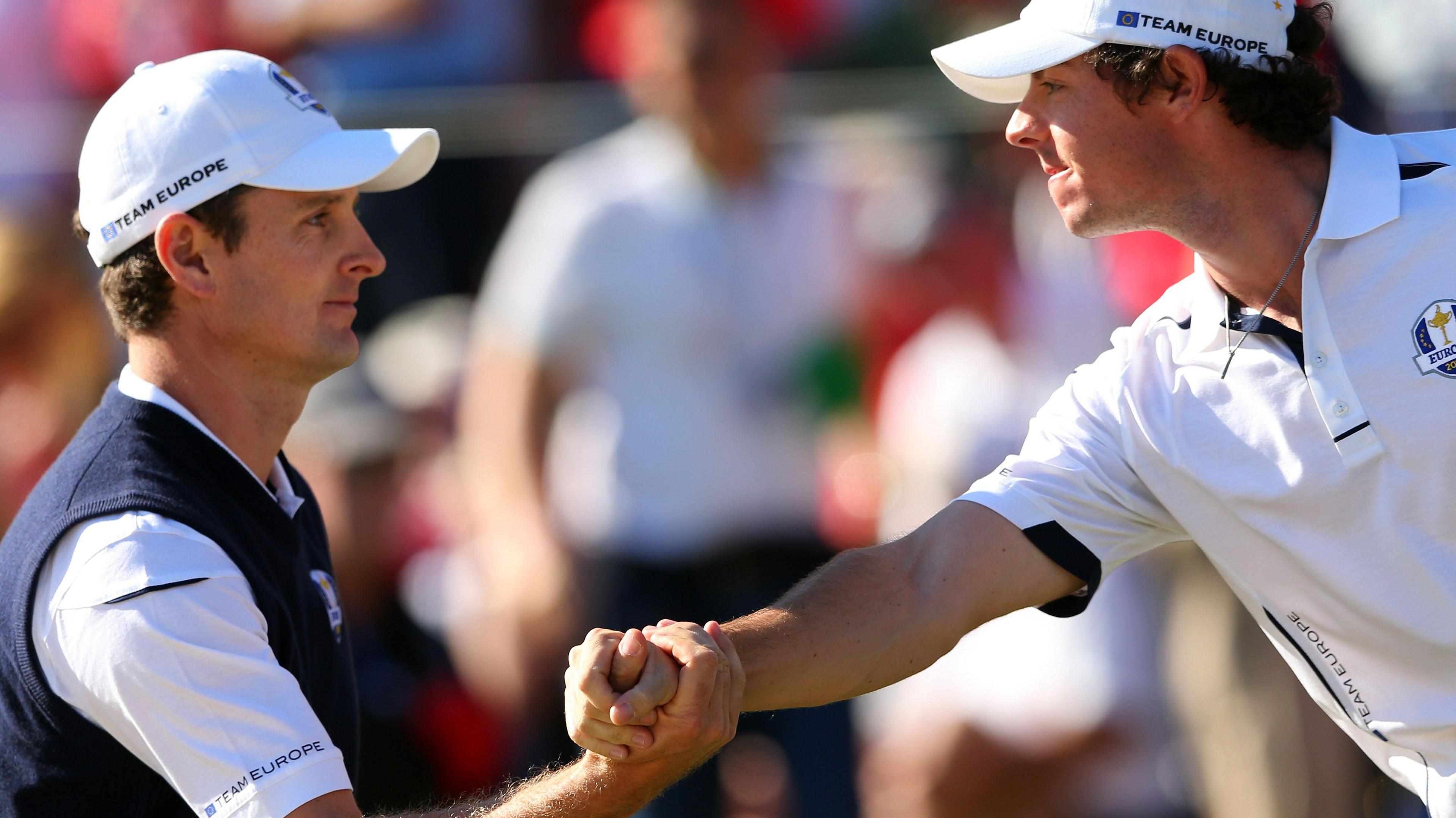 Justin Rose and Rory McIlroy shake hands during the 2012 Ryder Cup at Medinah that Europe came from 10-6 down on the final day to win.