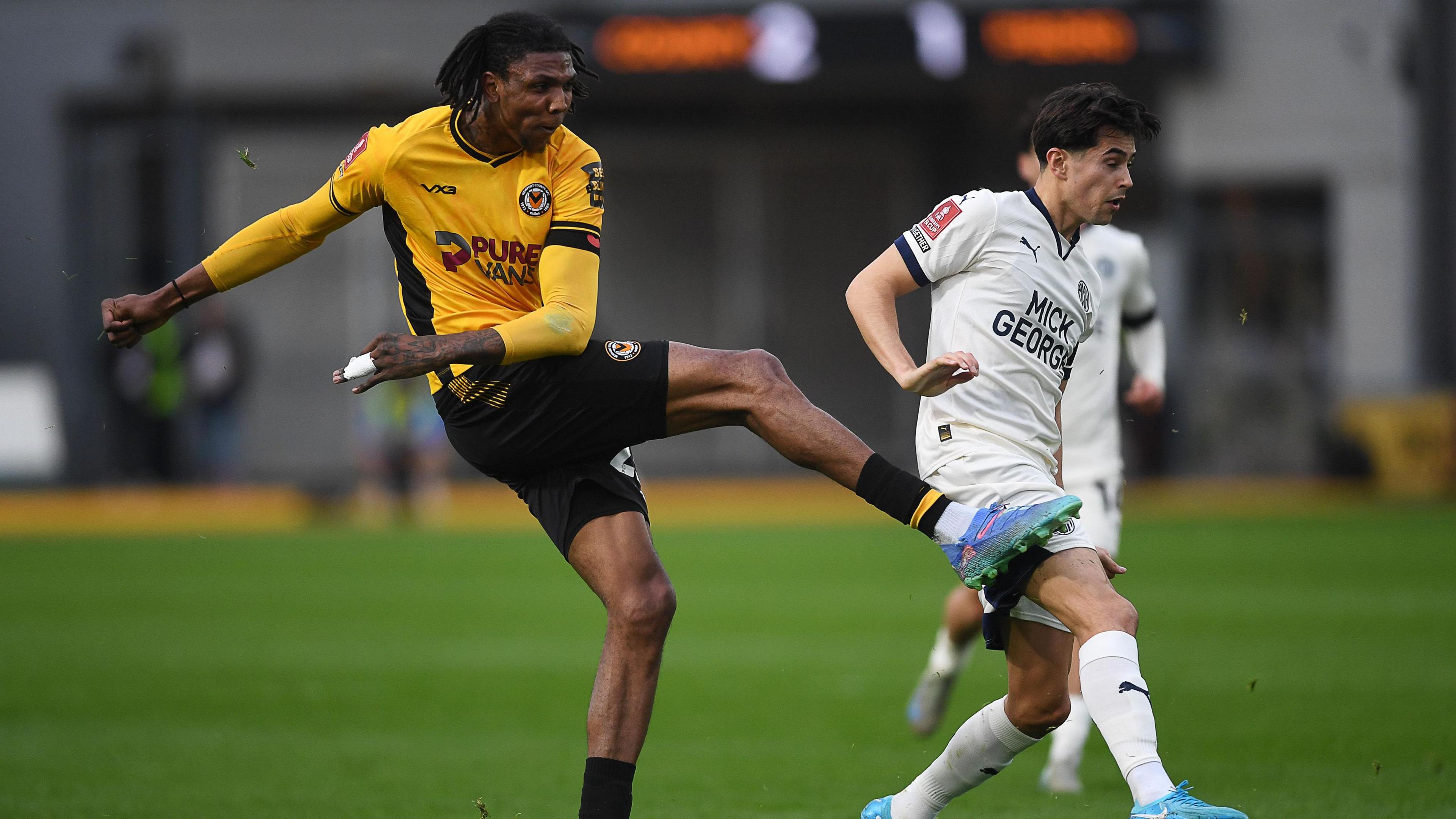 Kyle Hudlin of Newport County strikes the ball