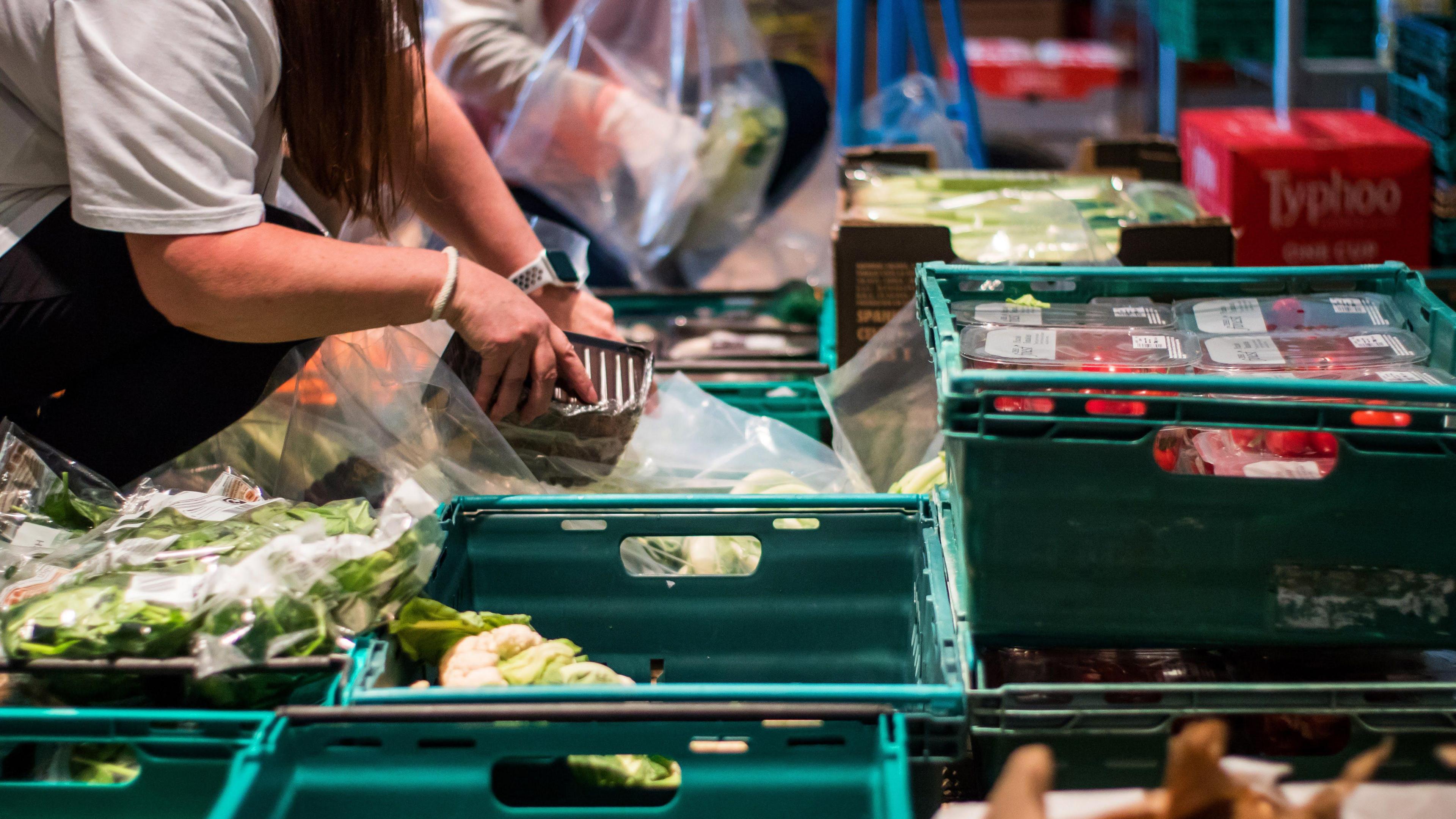 Woman with crate of food