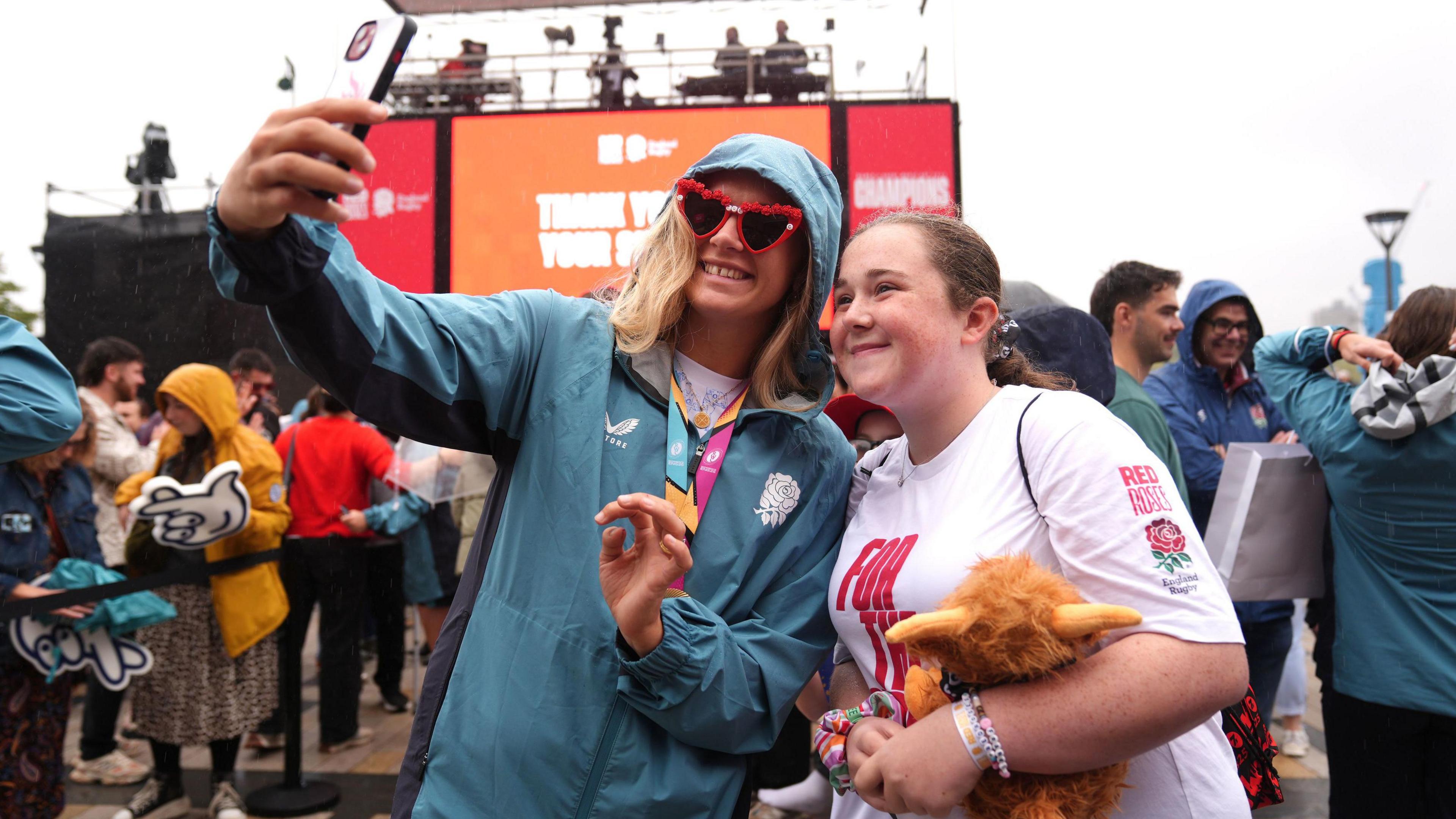 England's Zoe Aldcroft (left) poses for photographs with fans during a Champions Party at Battersea Power Station, London. England won the Women's World Cup with a 33-13 victory over Canada at Allianz Stadium. Picture date: Sunday September 28, 2025. 