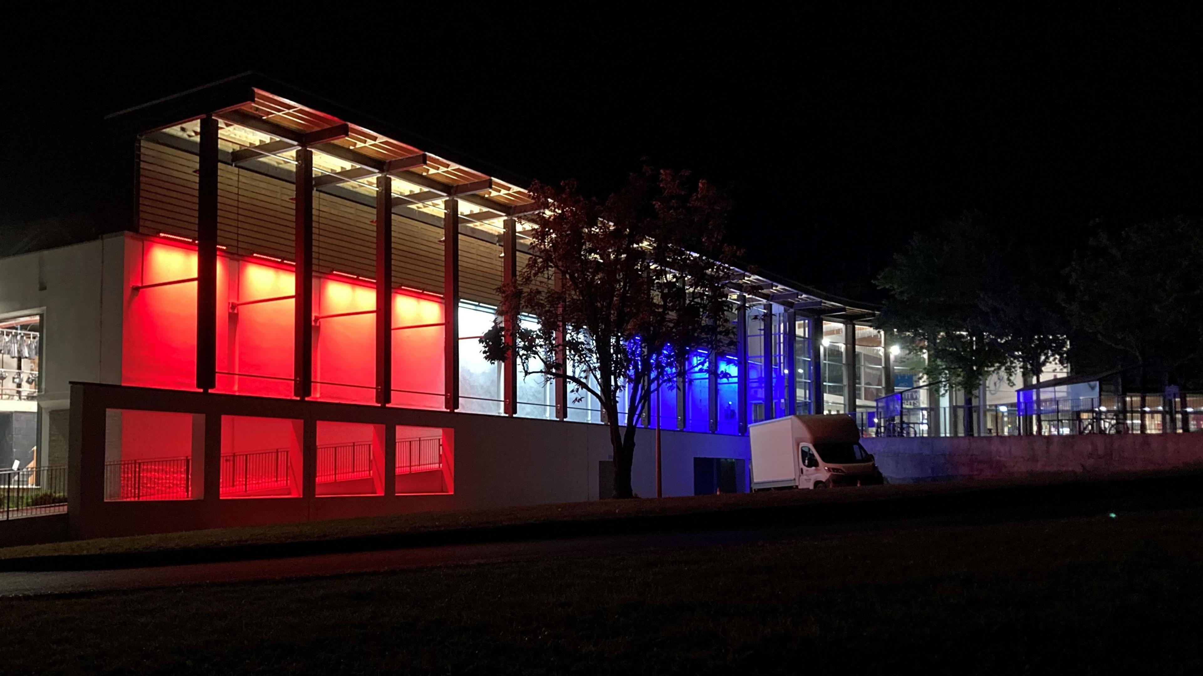 Beau Sejour Leisure Centre lit up in red, white and blue