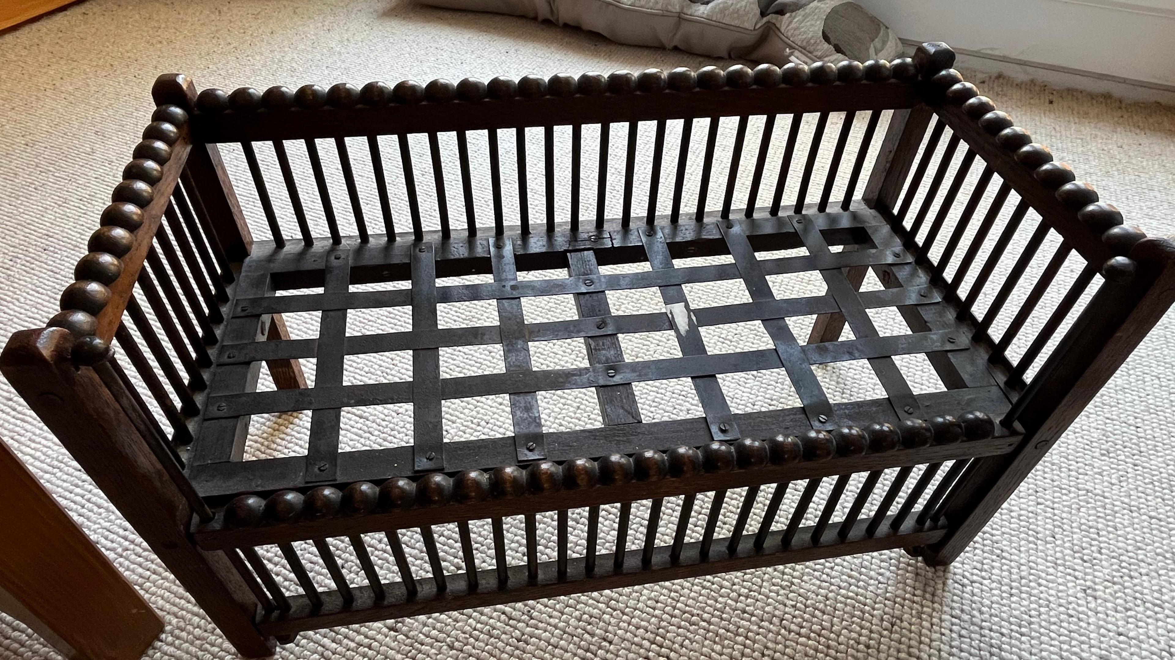 The old wooden cot Mrs Mathers has kept.