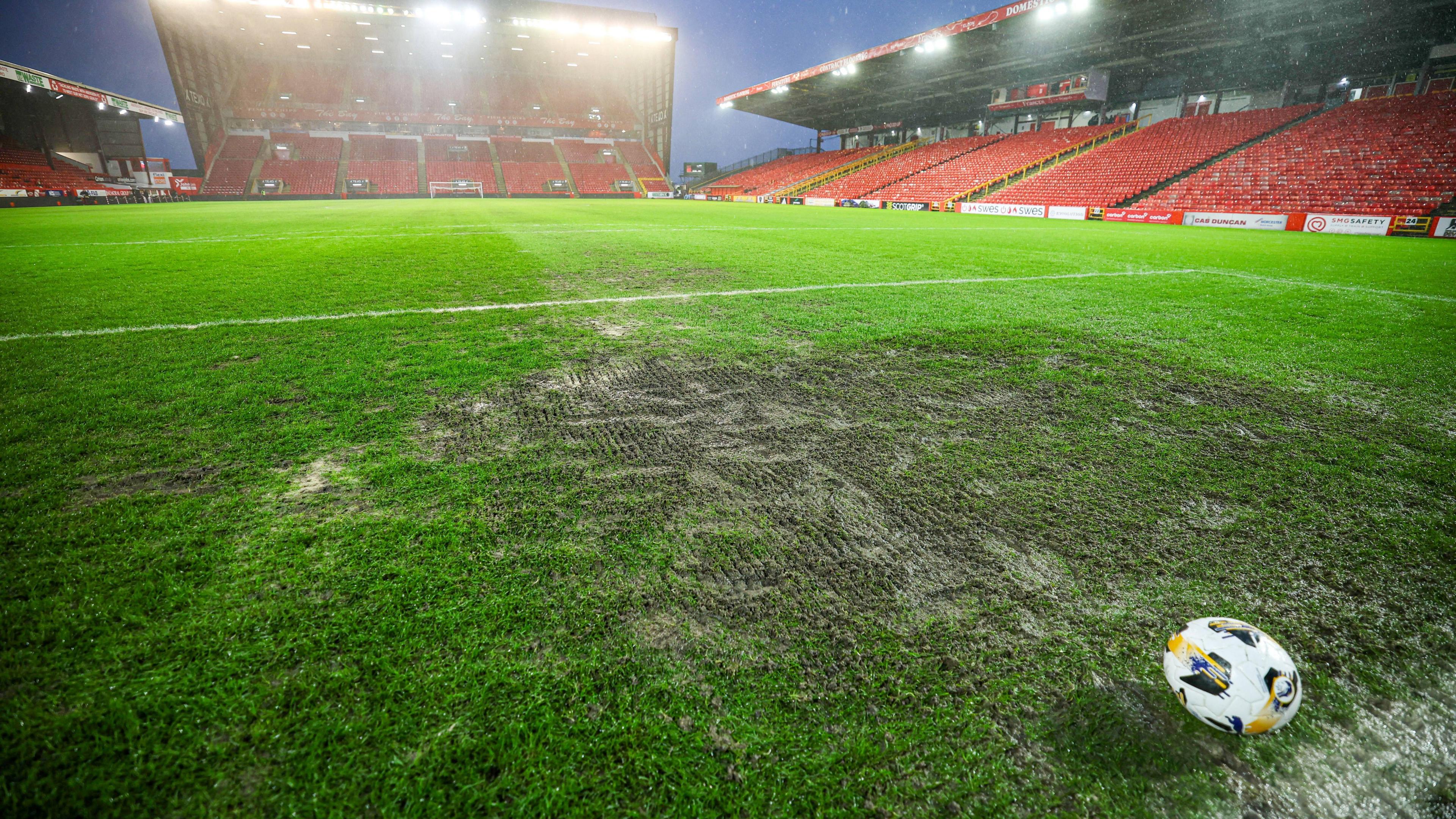 A ball sits in the penalty box of the Merkland Stand end of Pittodrie