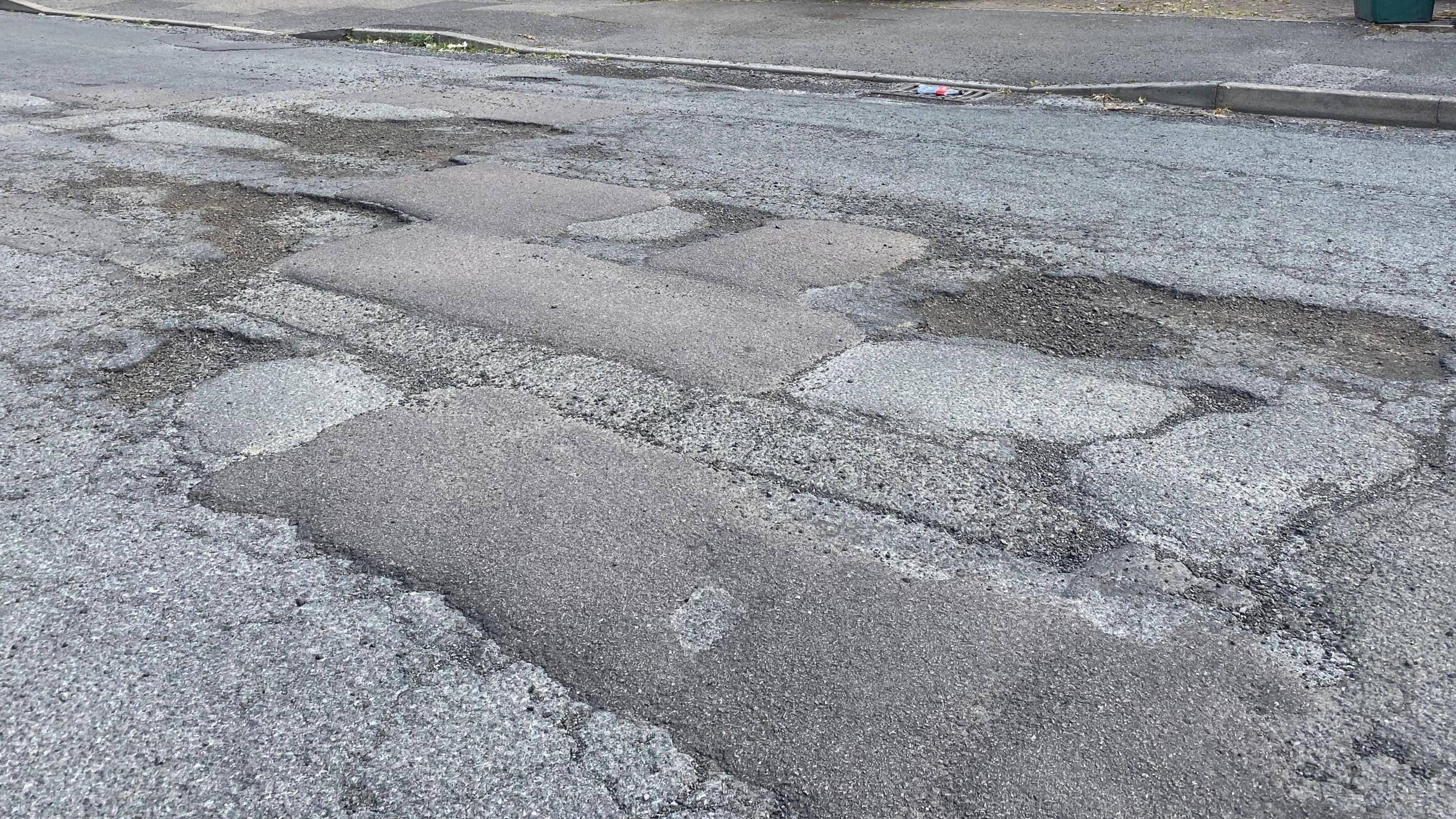 An image of potholes and filled potholes in a road in Digby Road, Mapperley, Nottingham