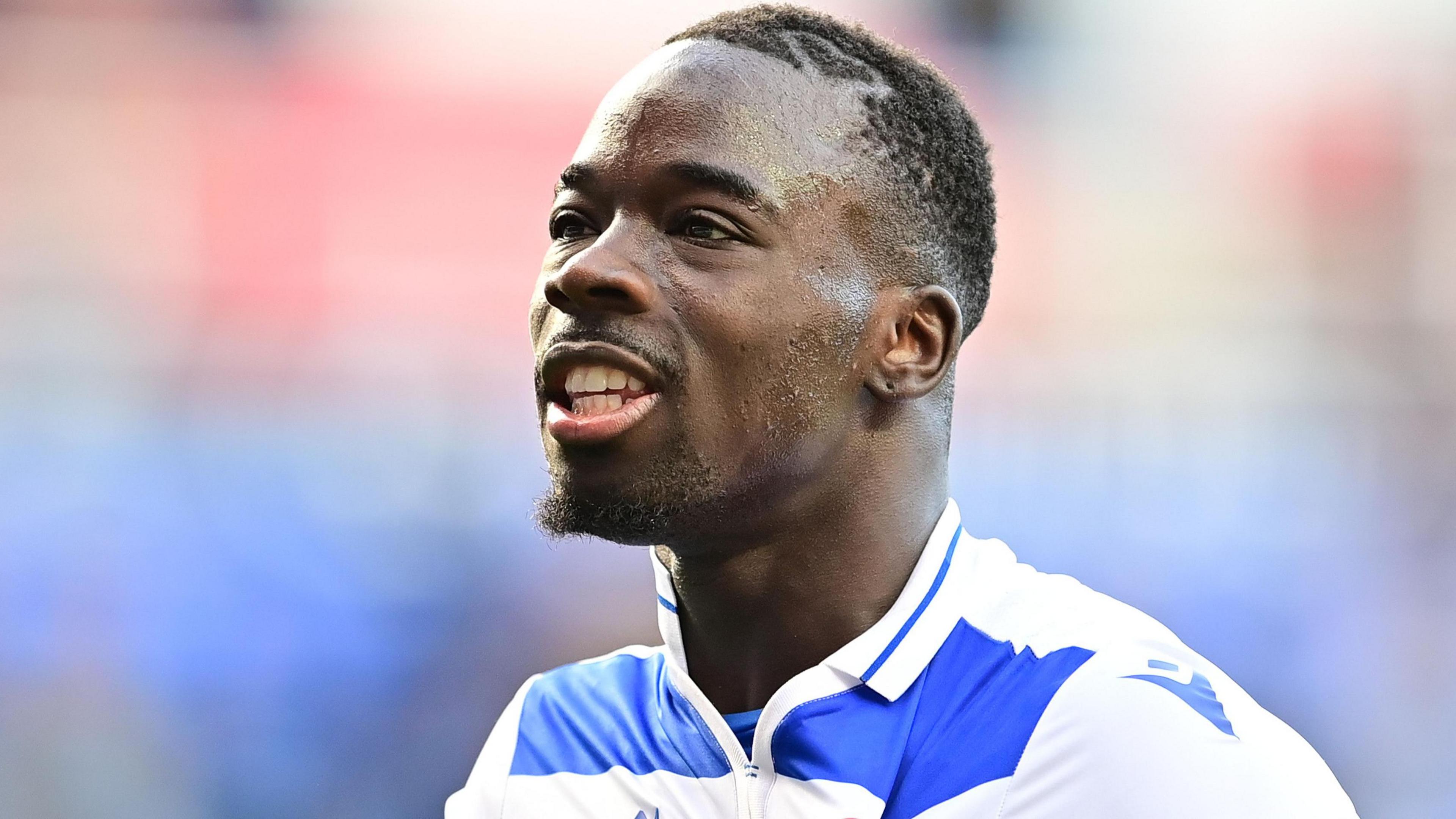 Amadou Mbengue celebrates a victory for Reading over Northampton Town