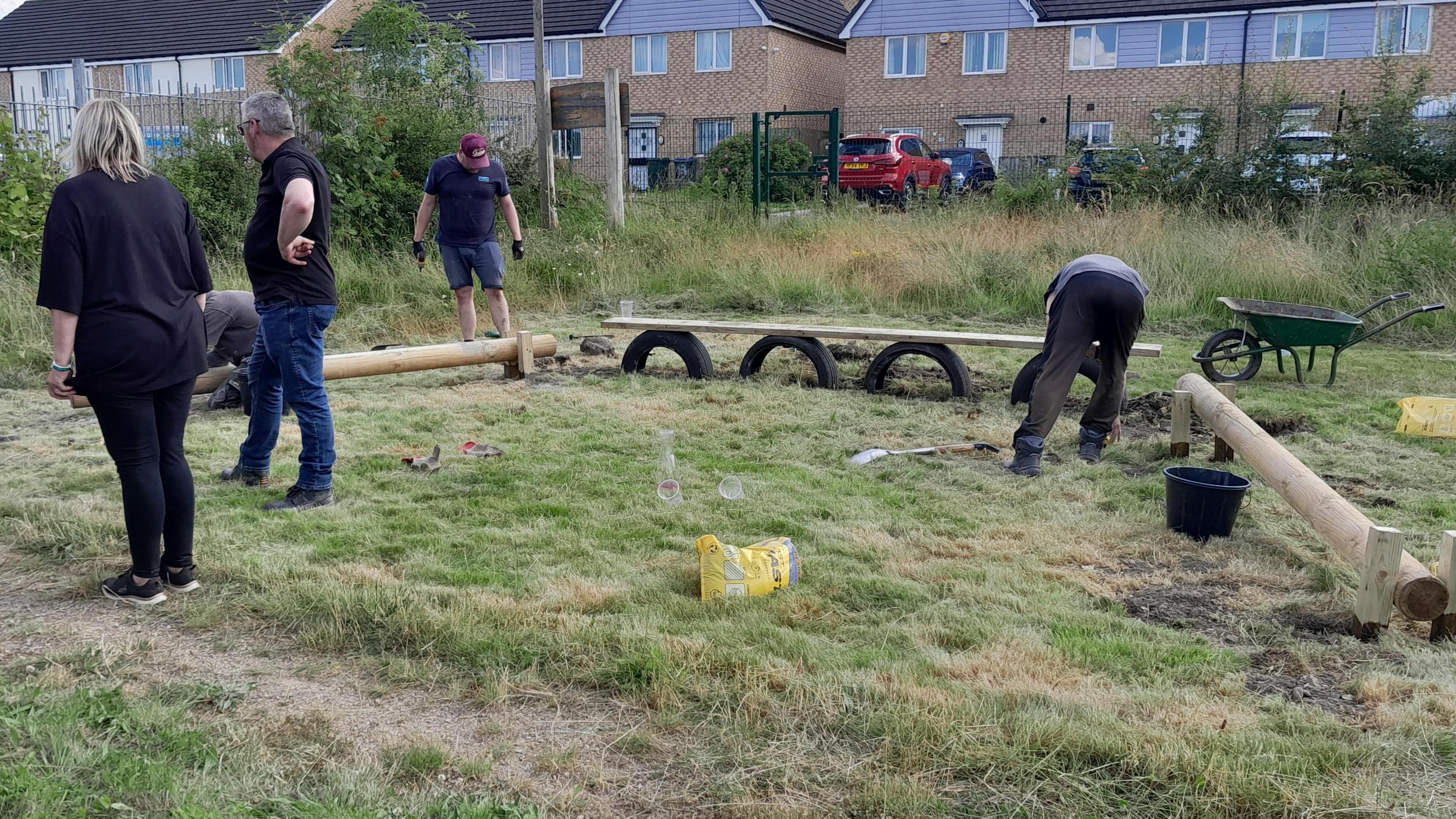 Volunteers setting up a play area