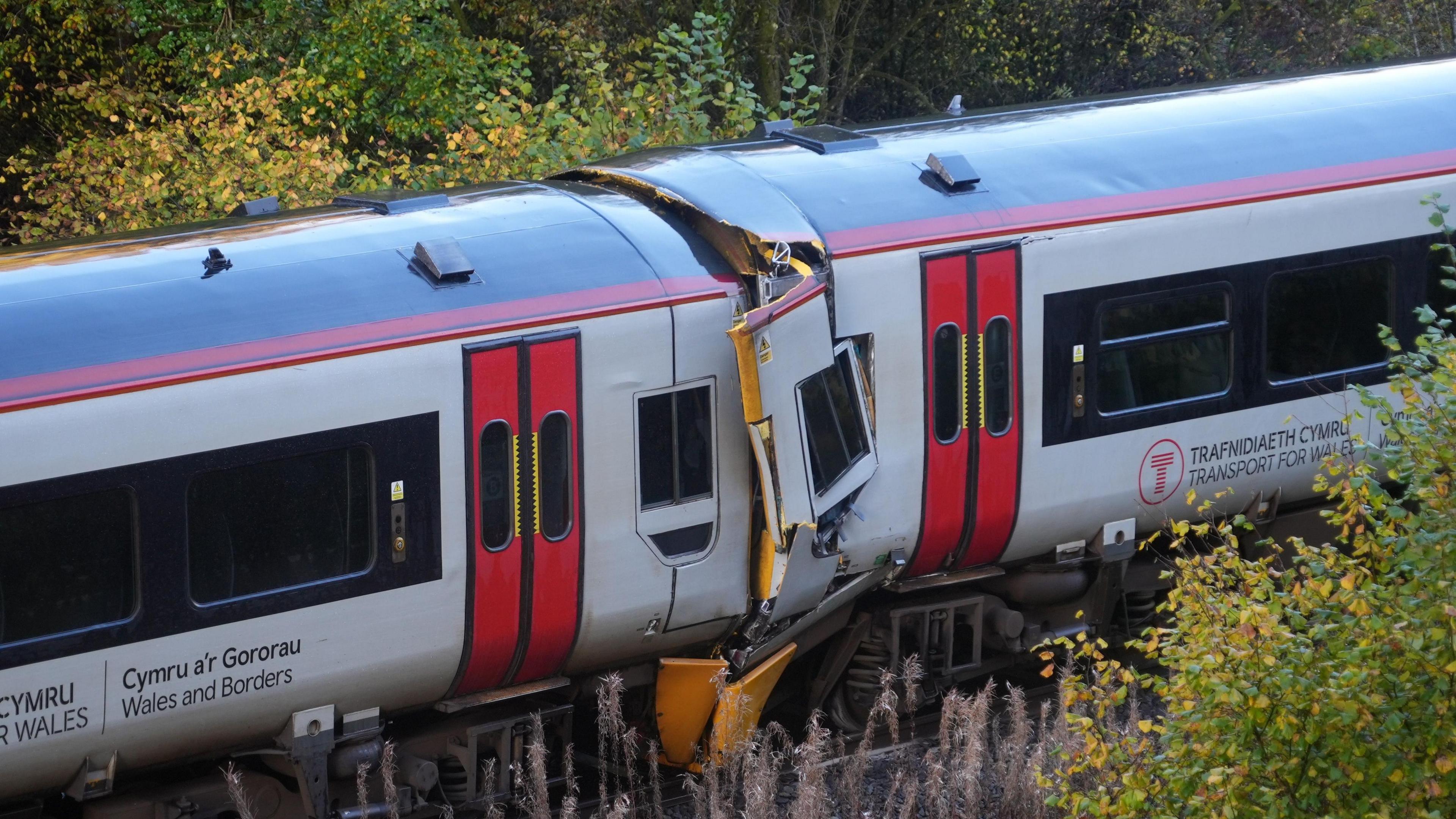 Two Transport for Wales trains after a crash in Powys, with damage visible