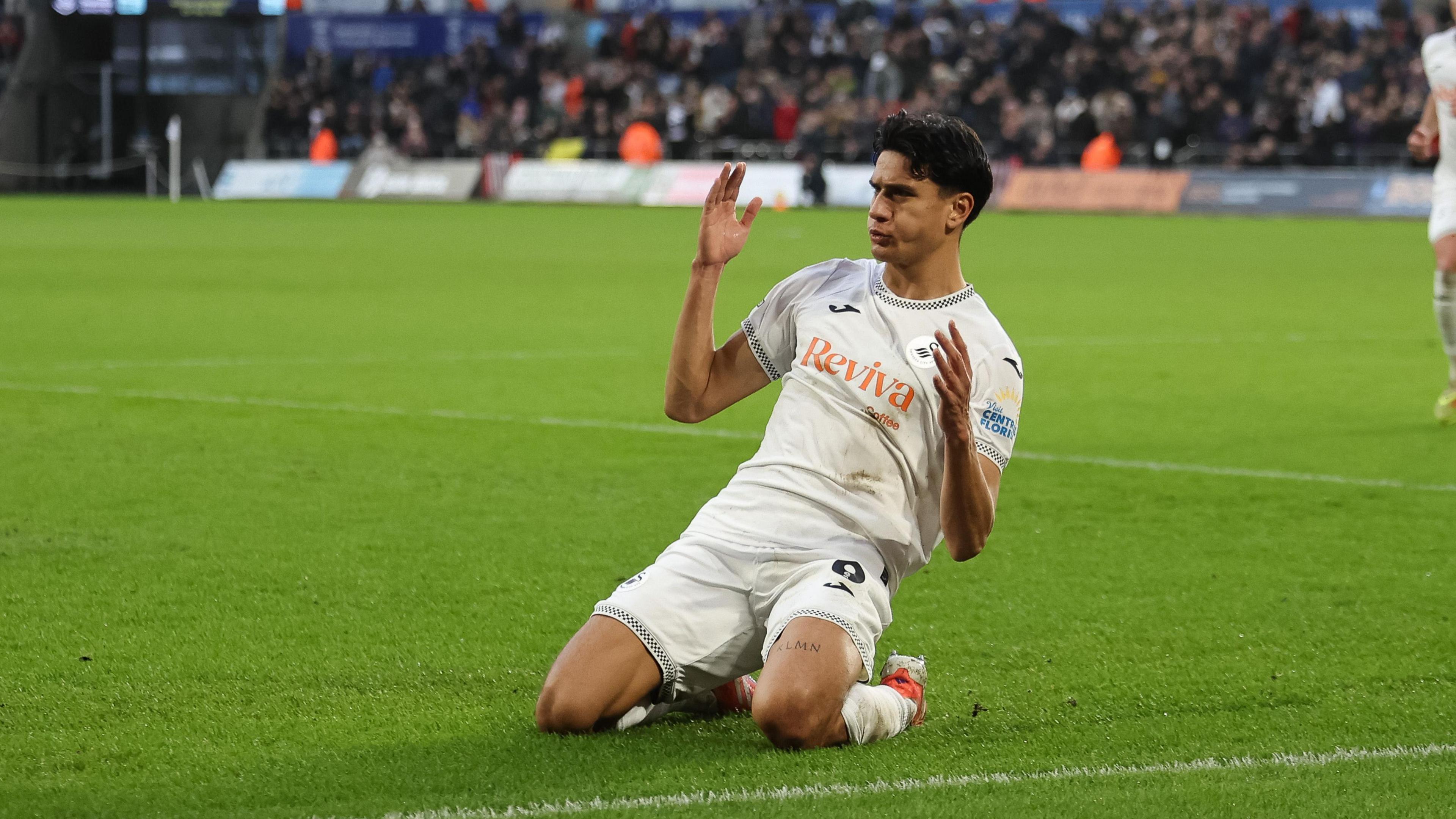 Marko Stamenic slides on his knees to celebrate scoring against Oxford in December