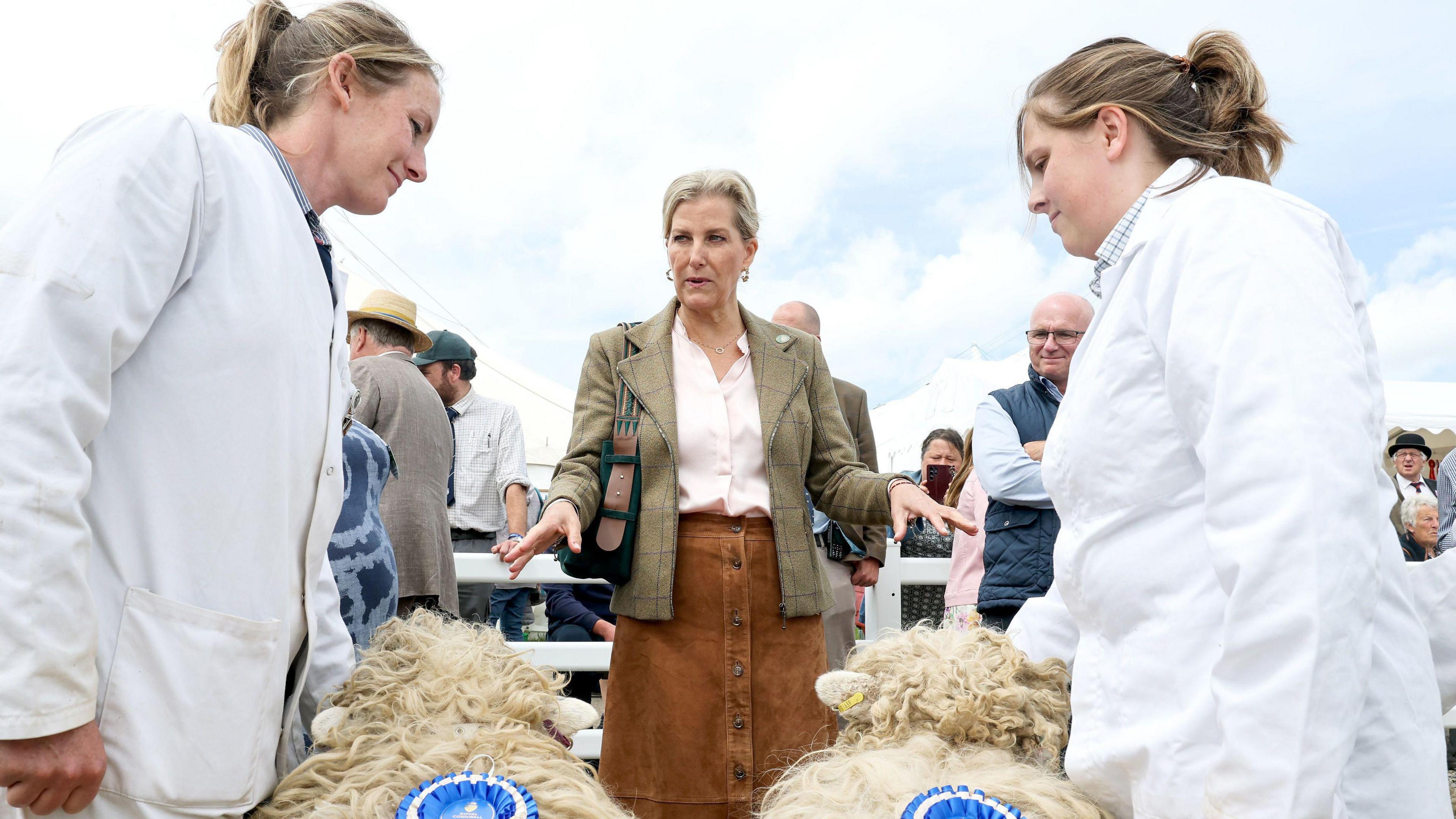 The Duchess of Edinburgh speaks to winners of sheep awards as she visits the Cattle, Pig, Sheep and countryside area as she attends the Royal Cornwall Show.