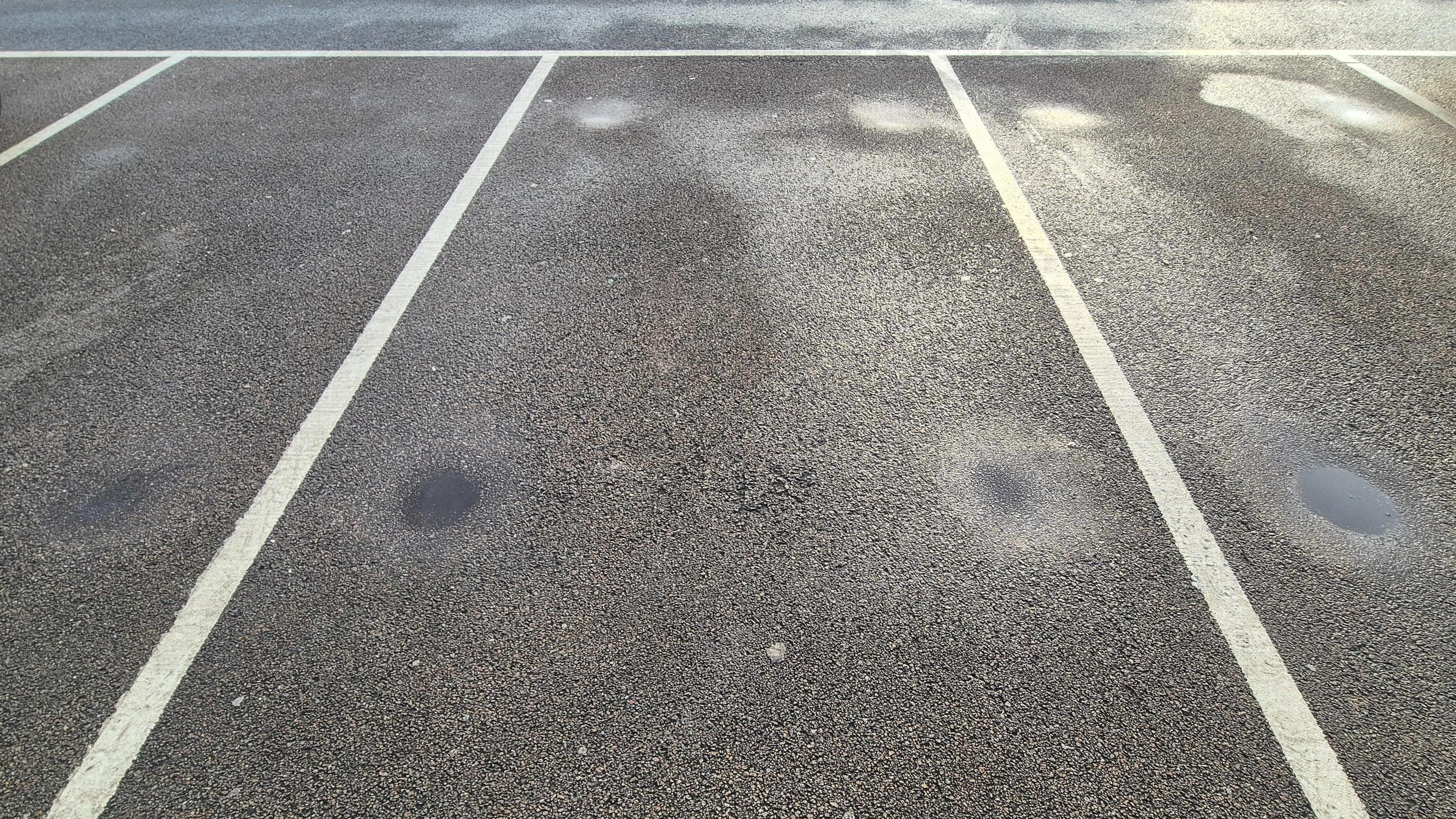 Three empty car parking spaces