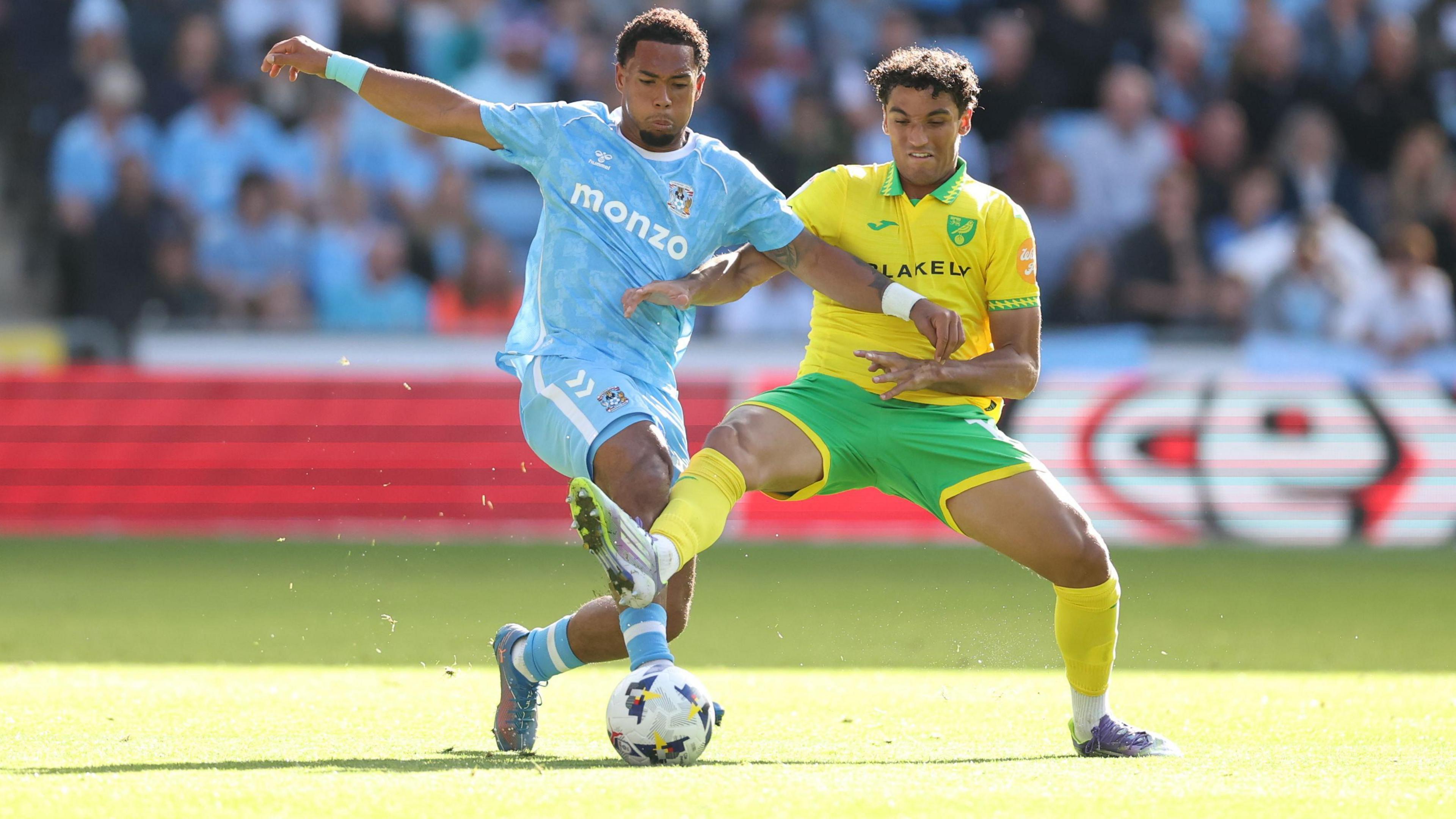 Milan van Ewijk of Coventry City and Ben Chrisene of Norwich City