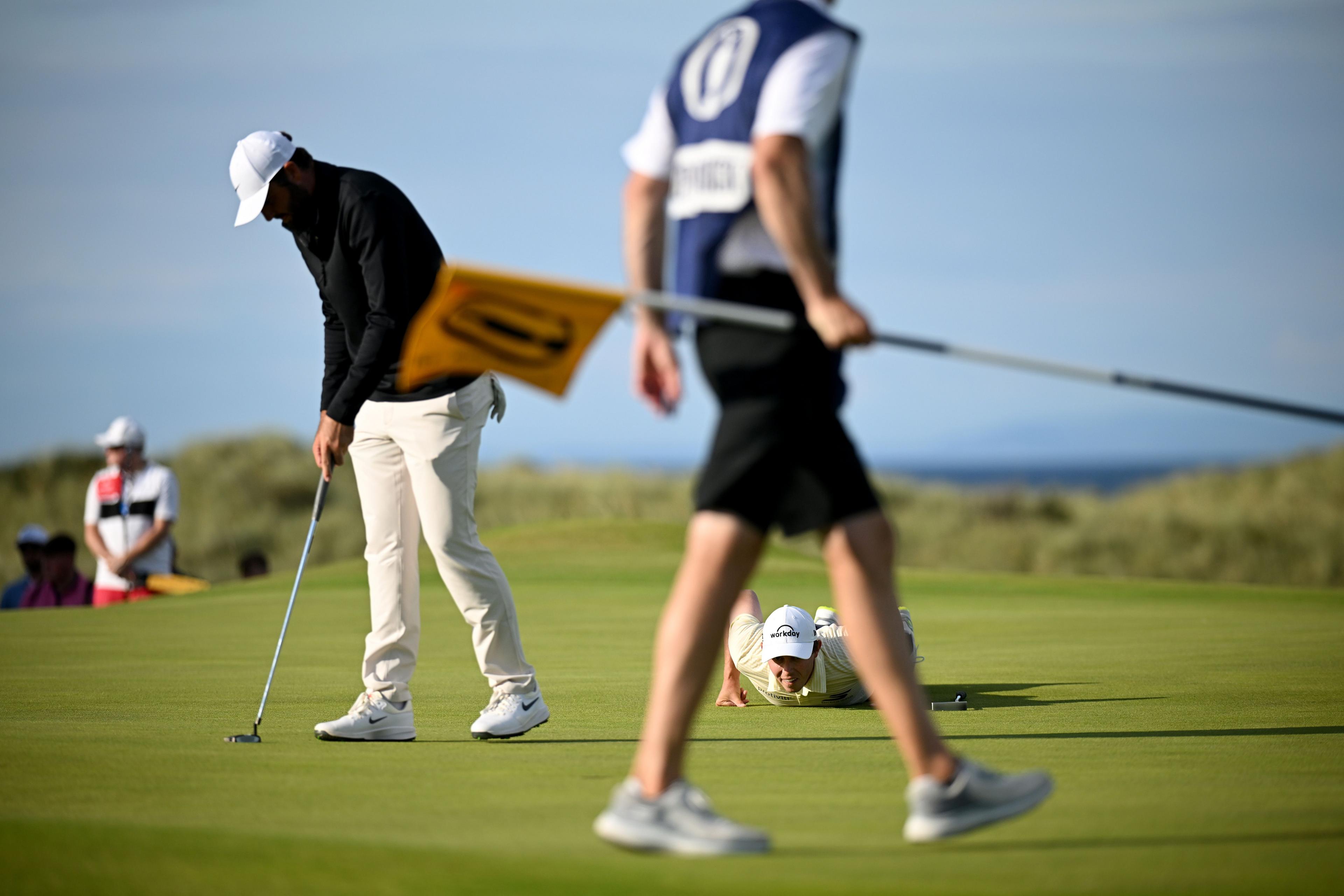 Matthew Fitzpatrick down to line up a putt