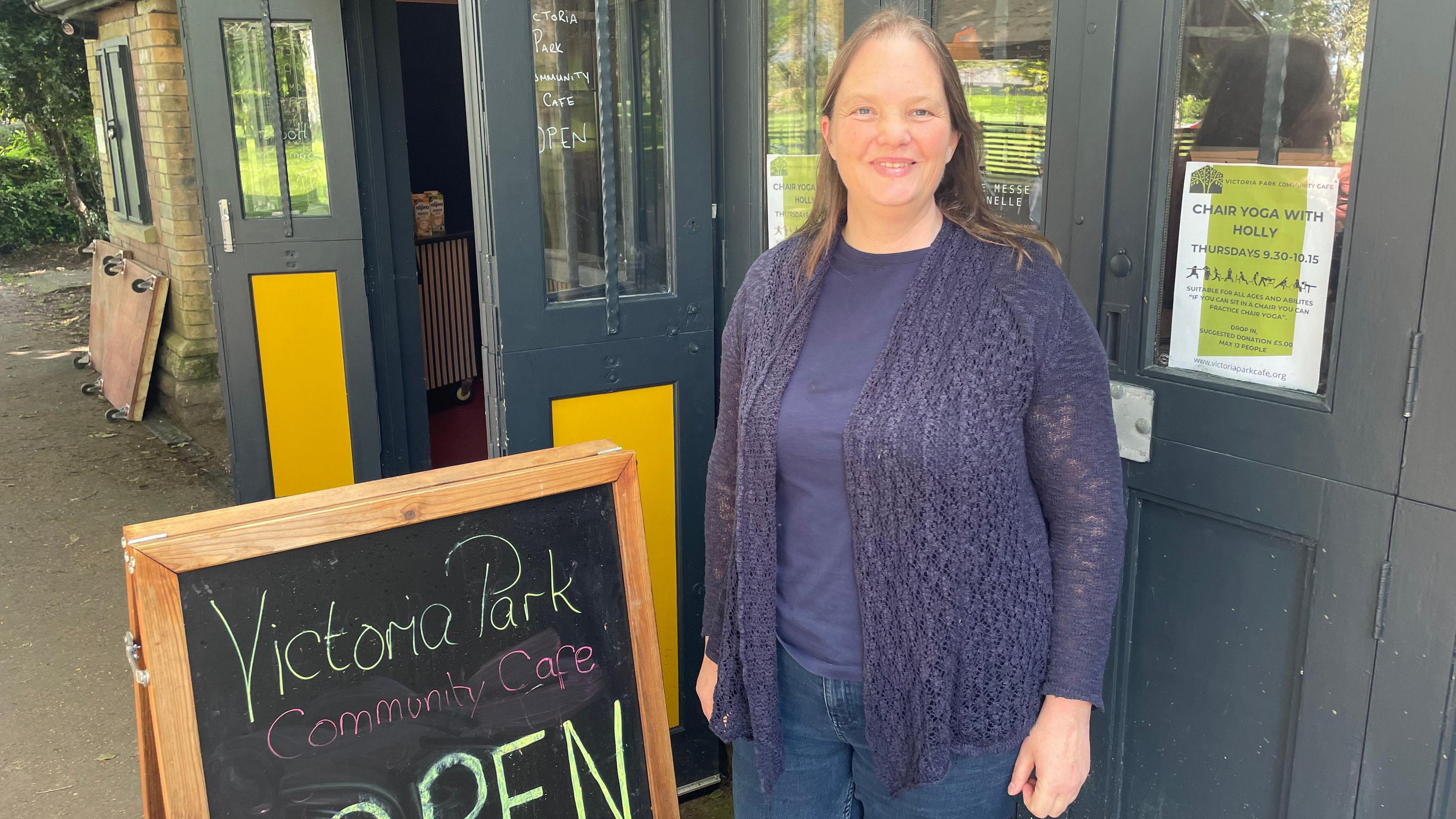 Sam Evans from community group Prosper Frome standing outside a shop in Frome.